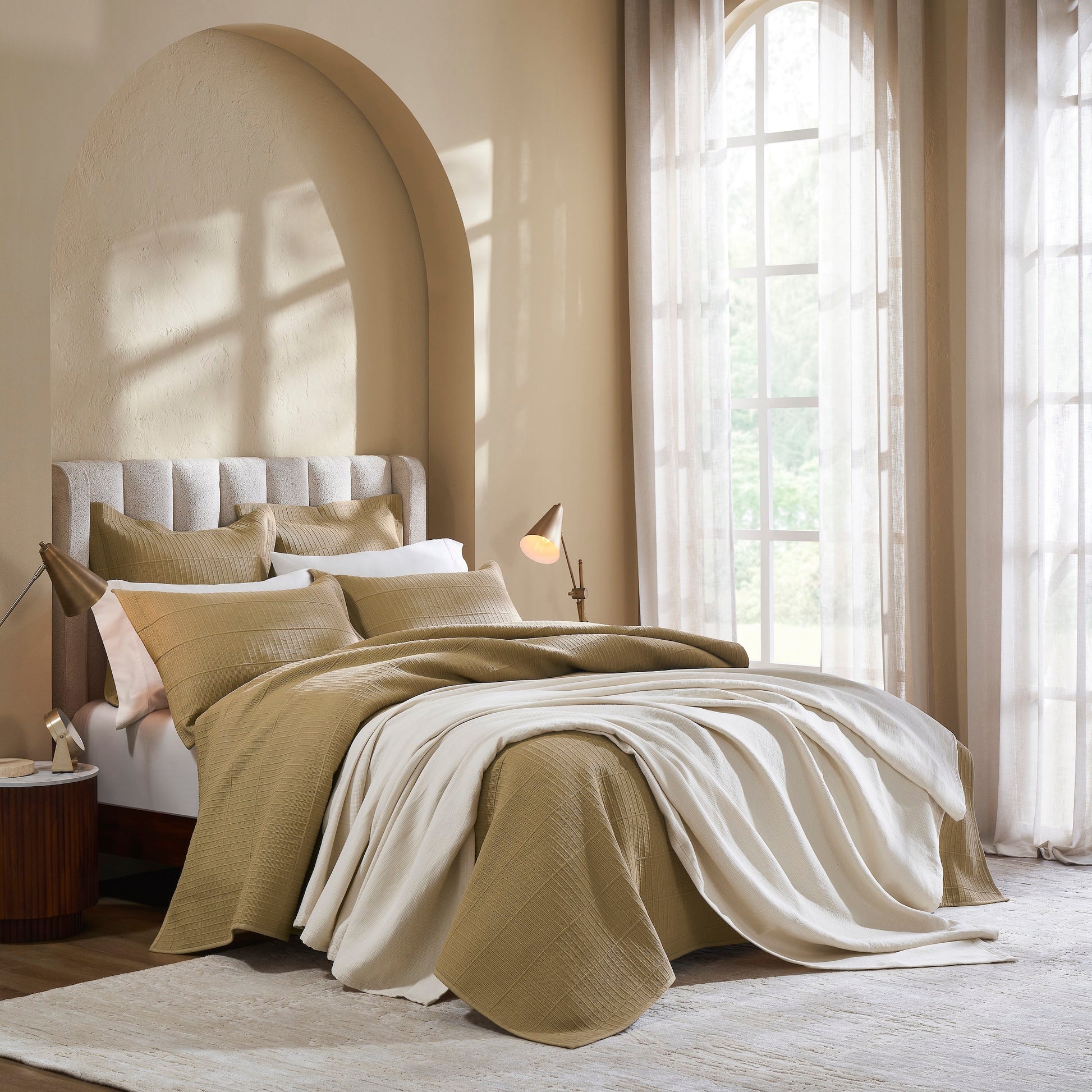 BL-860-11096_3|Soft cream waffle weave blanket draped over a neutral bedding set in a cozy, sunlit bedroom. Luxurious woven texture.