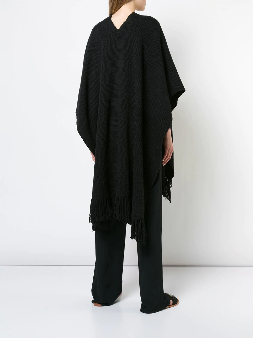 Model wearing a black Cotton Duna Fringe Duster from the back, showcasing the fringe detail.