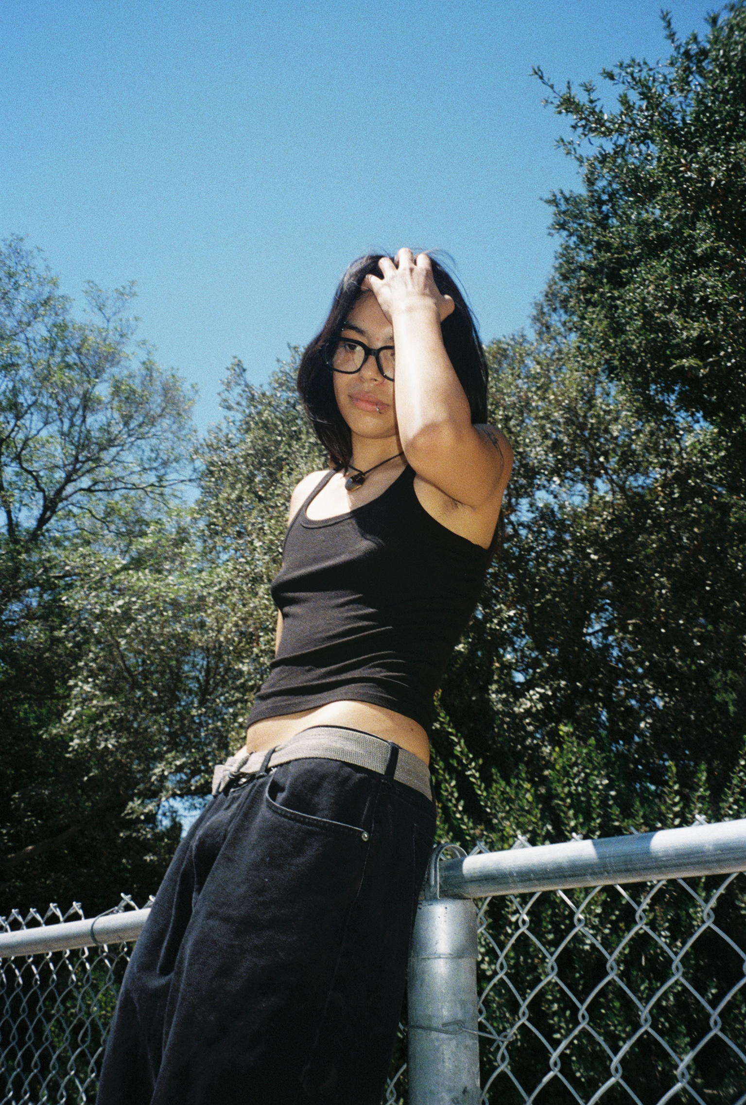 Woman wearing SAD Eyewear Dusk premium square glasses in black with clear blue light protection lenses