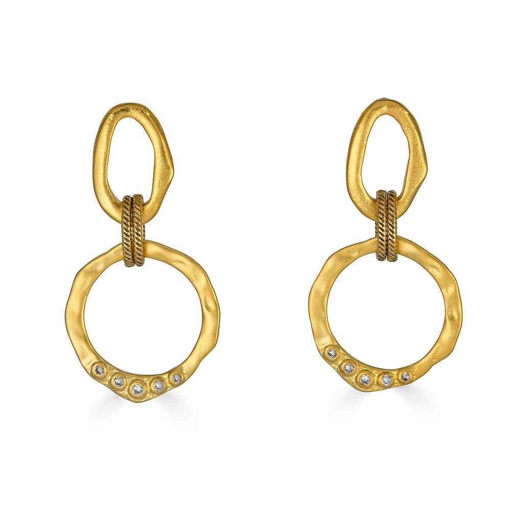 Large matte gold drop earrings with linked sculpted circles, rope-textured connector, and CZ stone accents on lower ring.