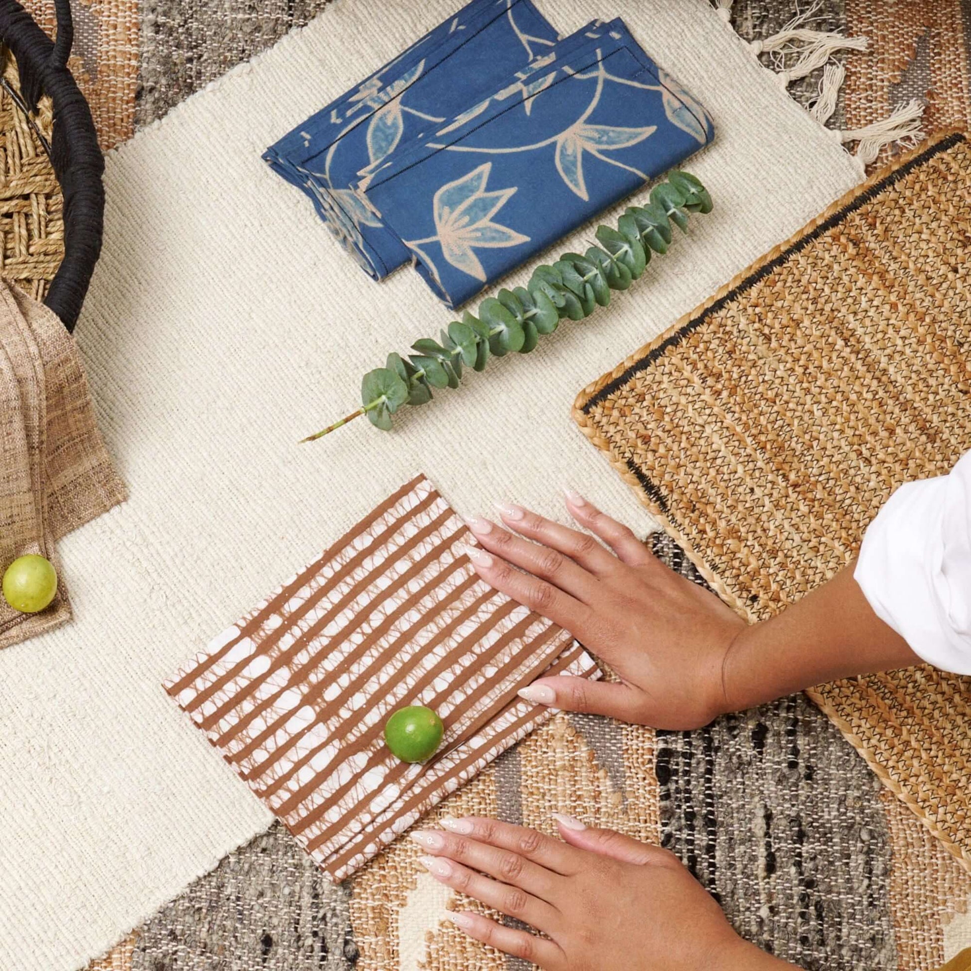 Folio Indigo Handcrafted Shibori Cotton Table Napkins ( set of 4 ) displayed with natural decor on a table.