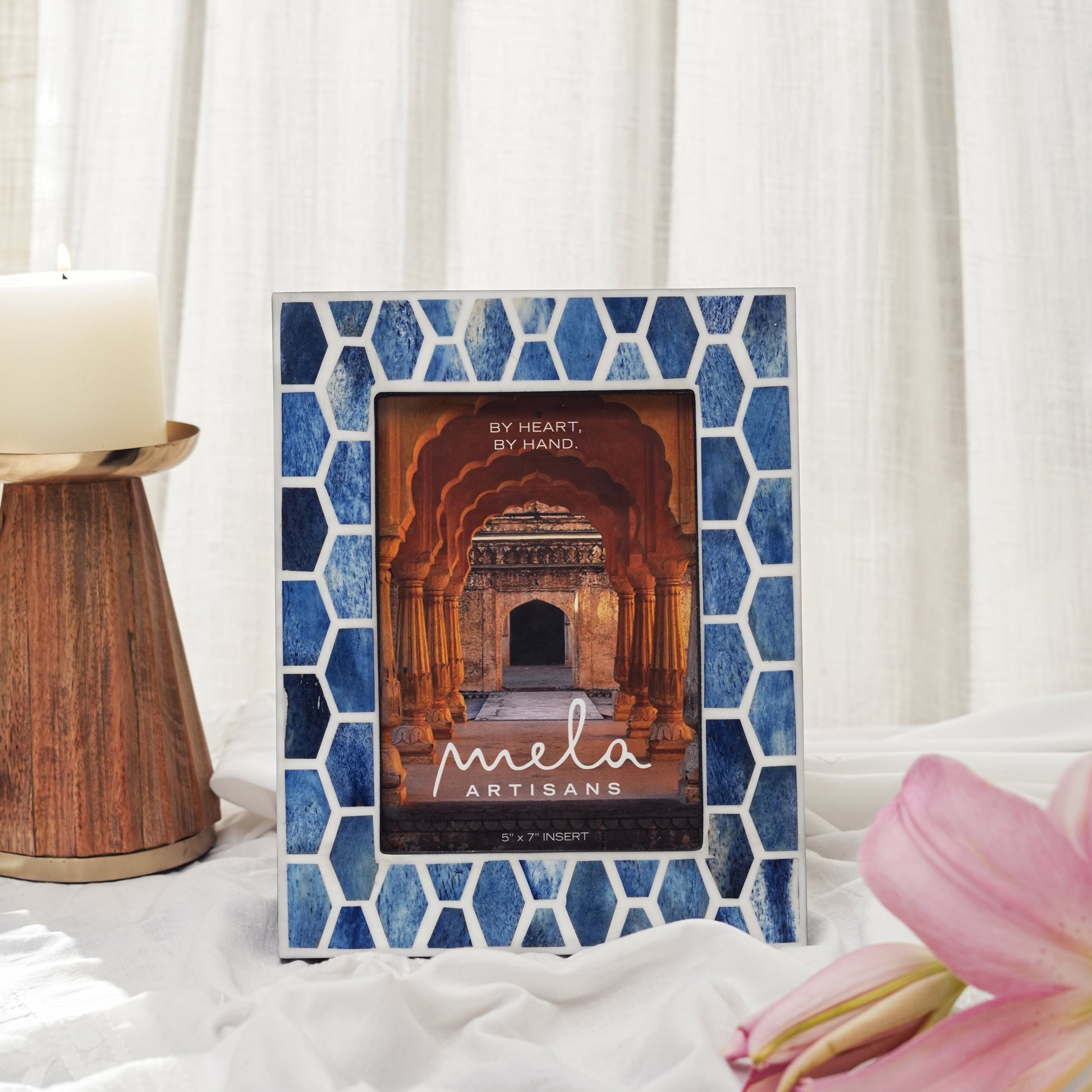 Decorative frame styled with photo on tabletop
