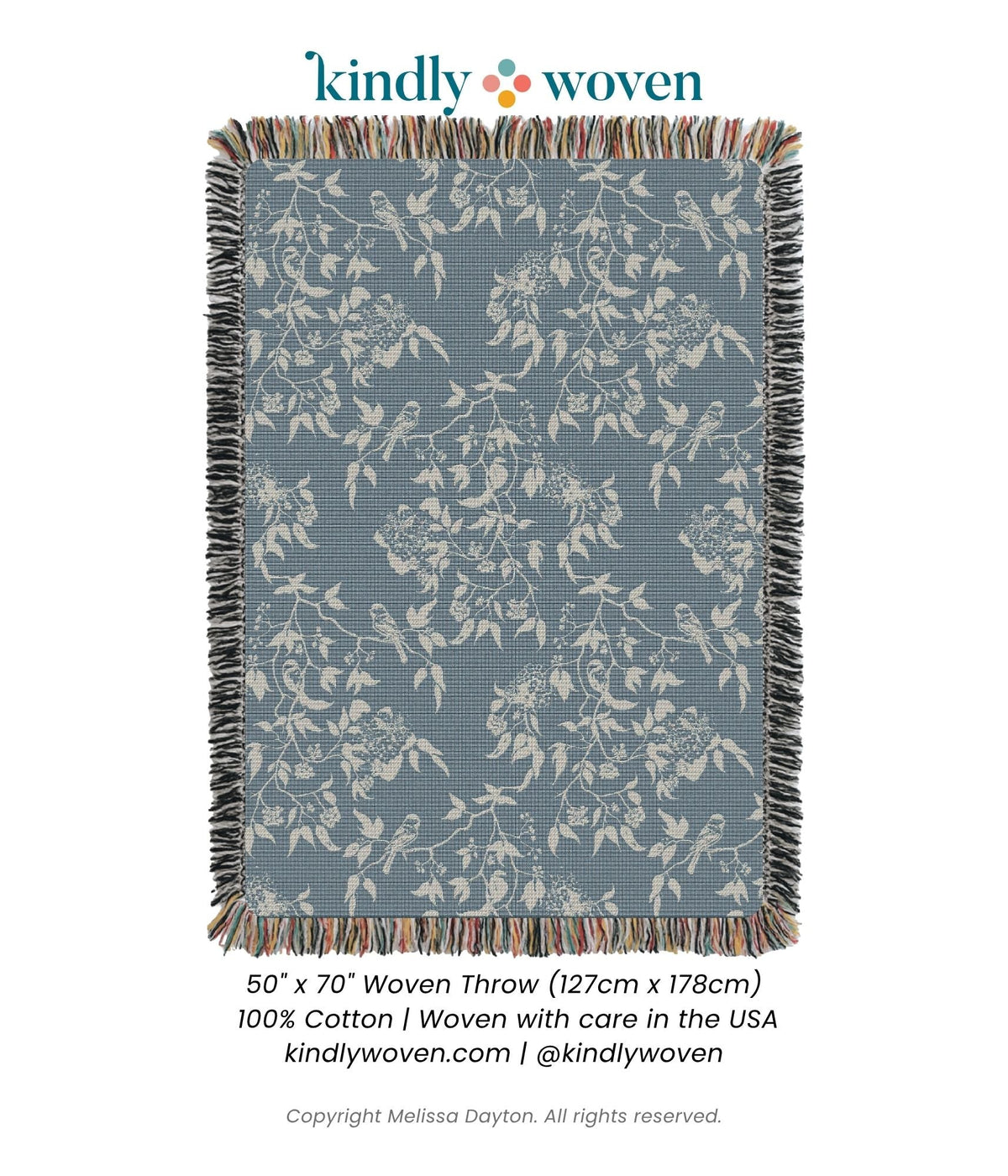 Full view of Wren Chambray blue bird and botanical woven throw blanket with fringe