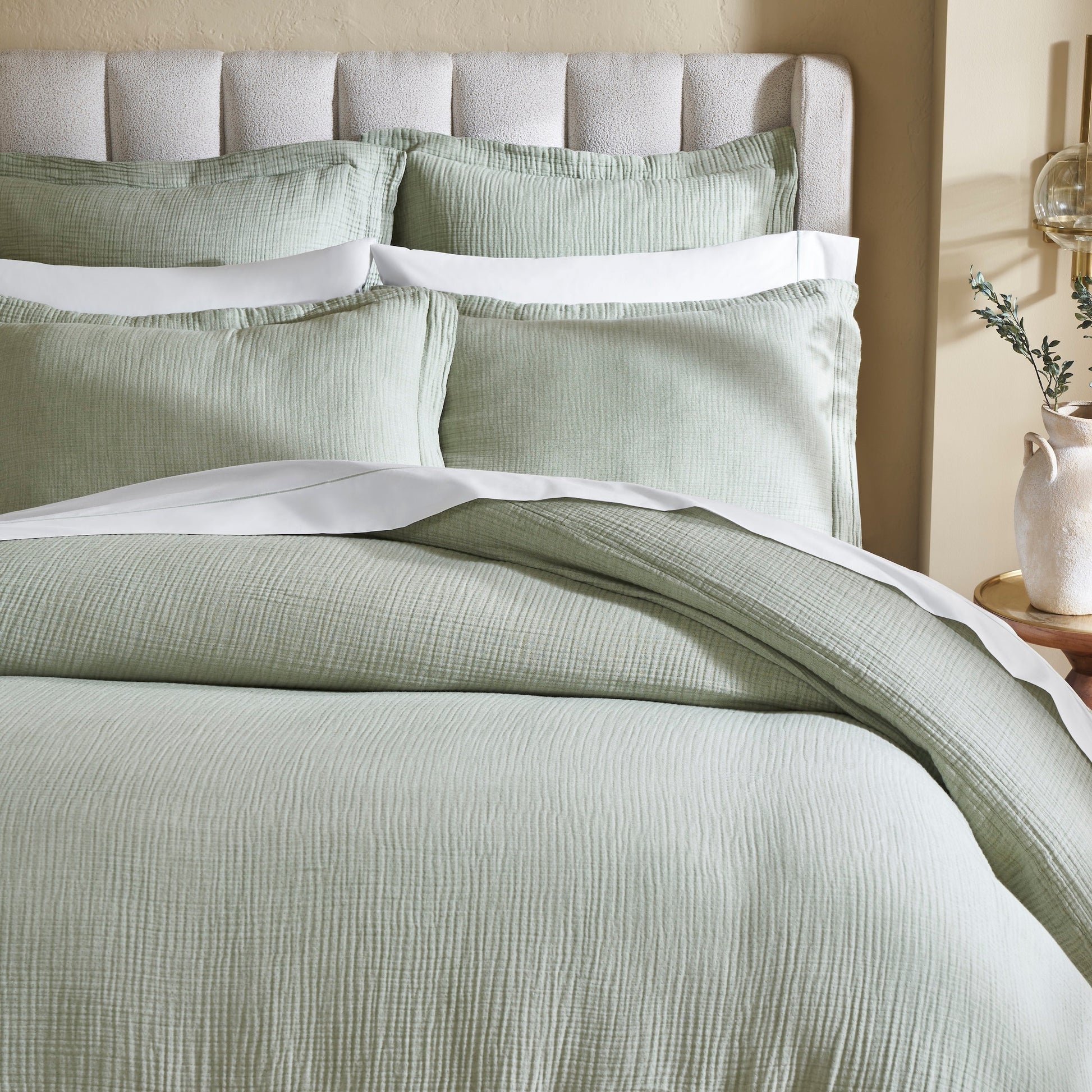 DT-051-9092_3|Close-up of luxurious light green textured muslin duvet cover and matching shams, showcasing soft, inviting bedding details.