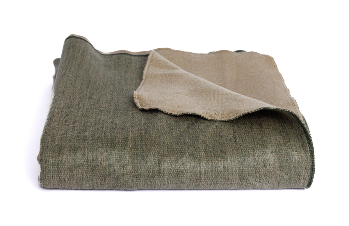 olive green throw blanket folded