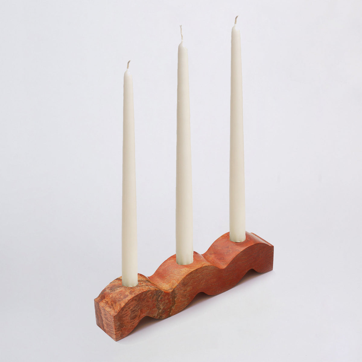 Wavy Jasper gemstone candelabra showcasing its unique natural patterns and warm earth tones on a white background.