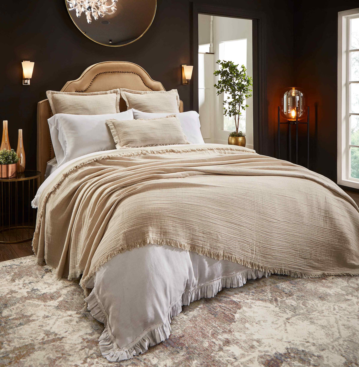 BT-115-11096_1|Luxurious beige textured blanket with a stylish fringe edge draped over a bed, adding warmth and elegance to modern bedroom decor.
