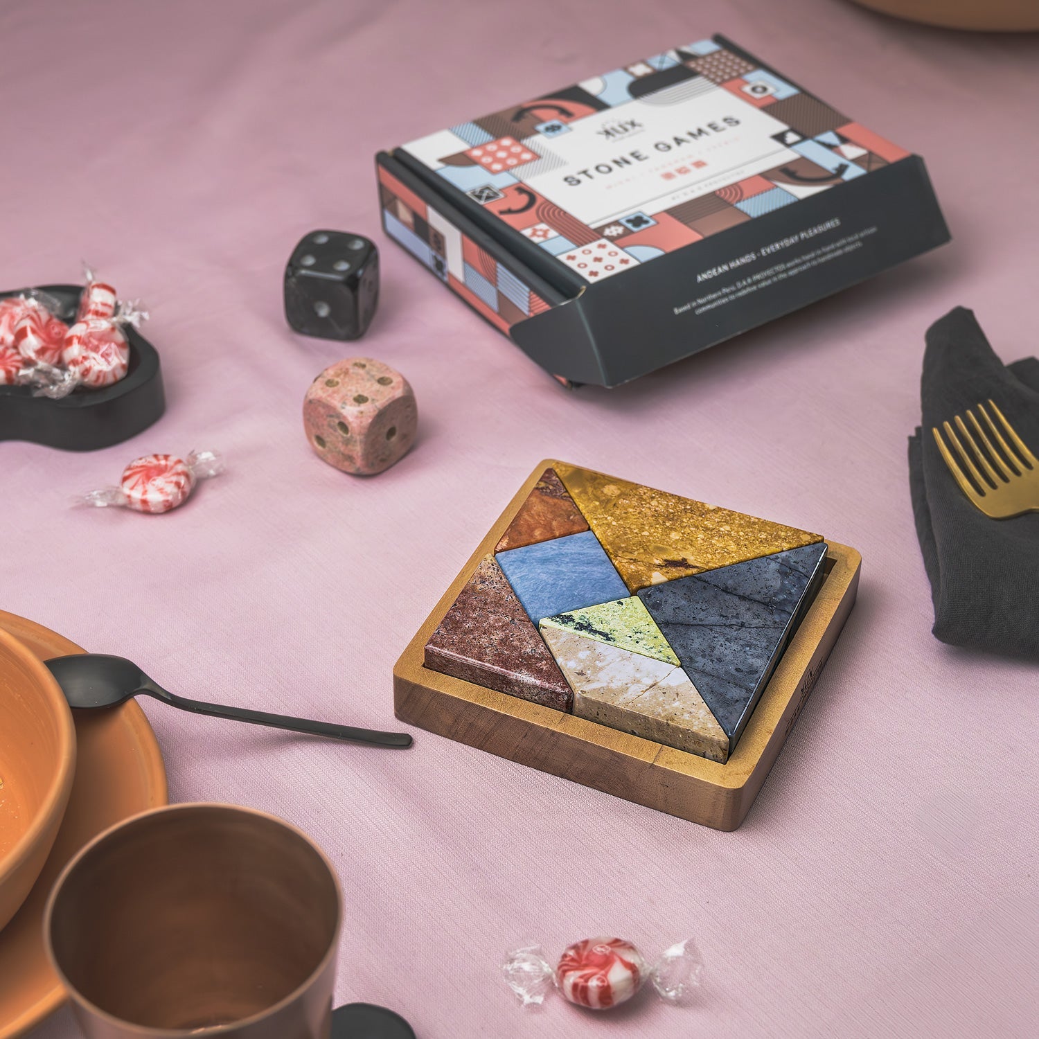 Handcrafted Tangram gemstone puzzle elevating a modern tabletop with its slow design aesthetic.