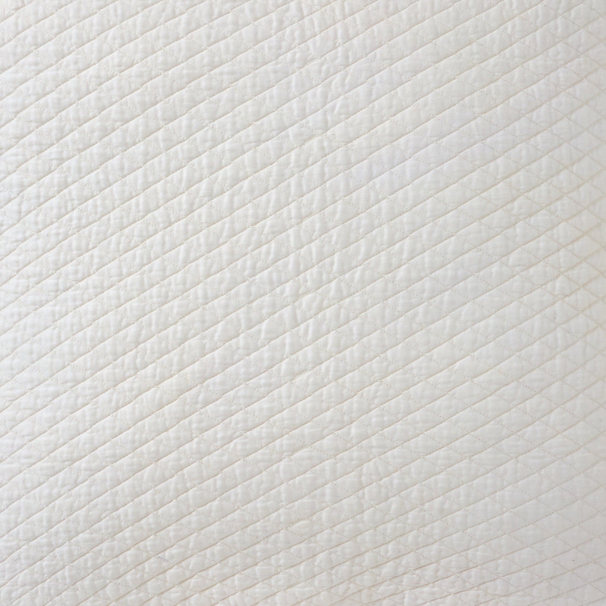 KS-265-2036_2|Luxurious cream diagonal channel quilted fabric with refined linear stitching, perfect for an elegant coverlet. Soft, inviting texture.