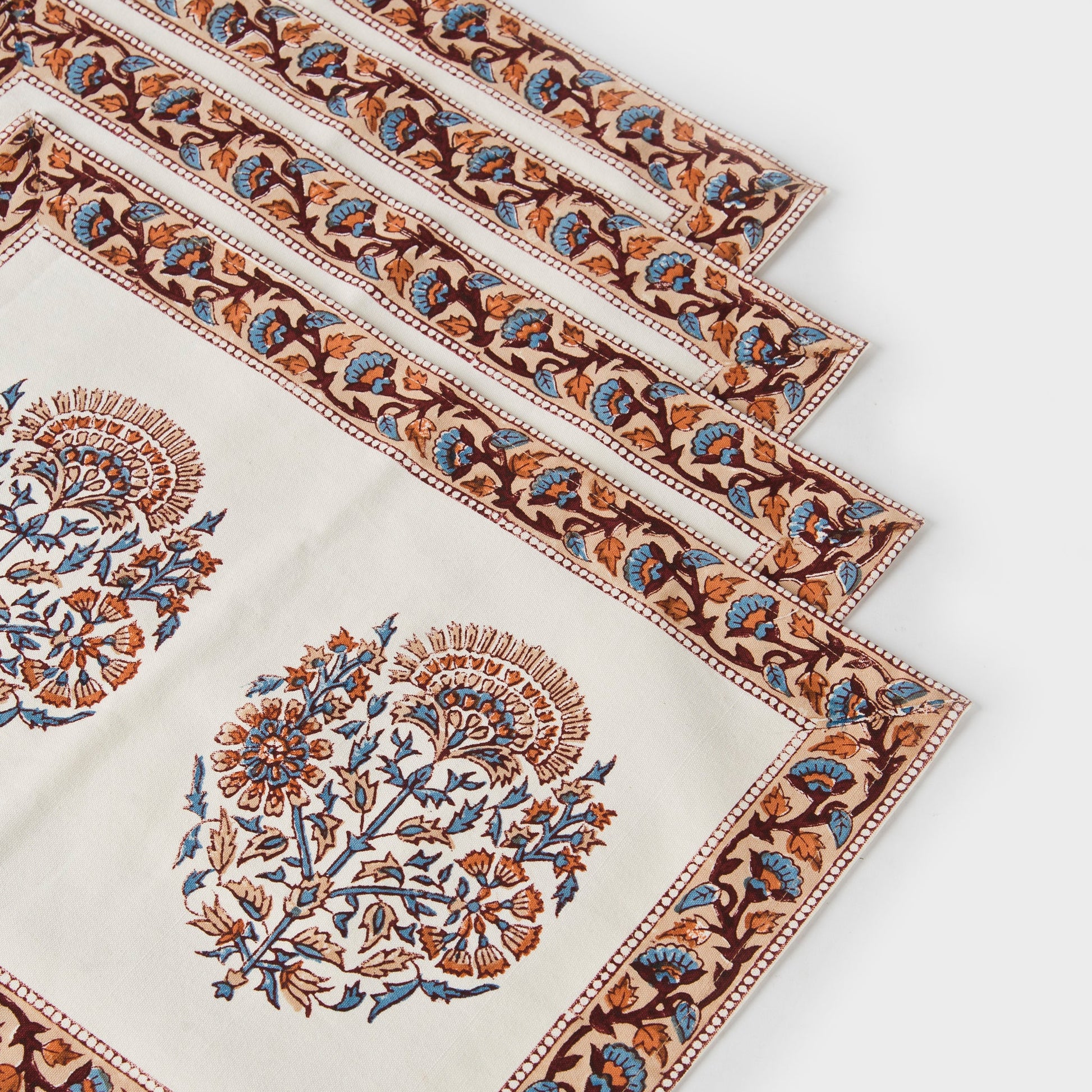 Bohemian style pink floral cotton placemats for elegant dining table decor.