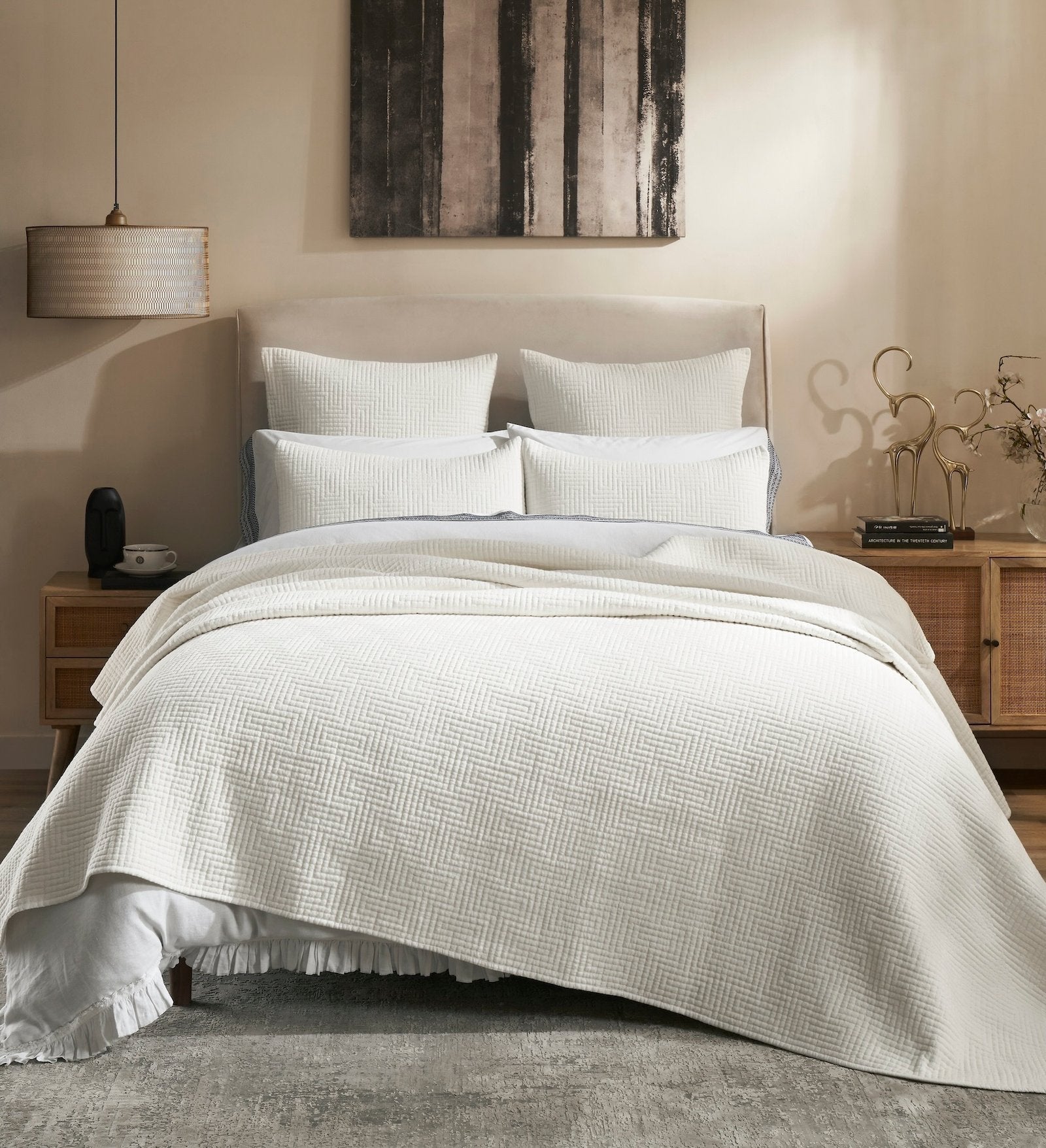 CL-199-X_1|Cozy bedroom with white quilted bed pillows and shams, enhancing the comfort and style of a modern sleeping retreat.