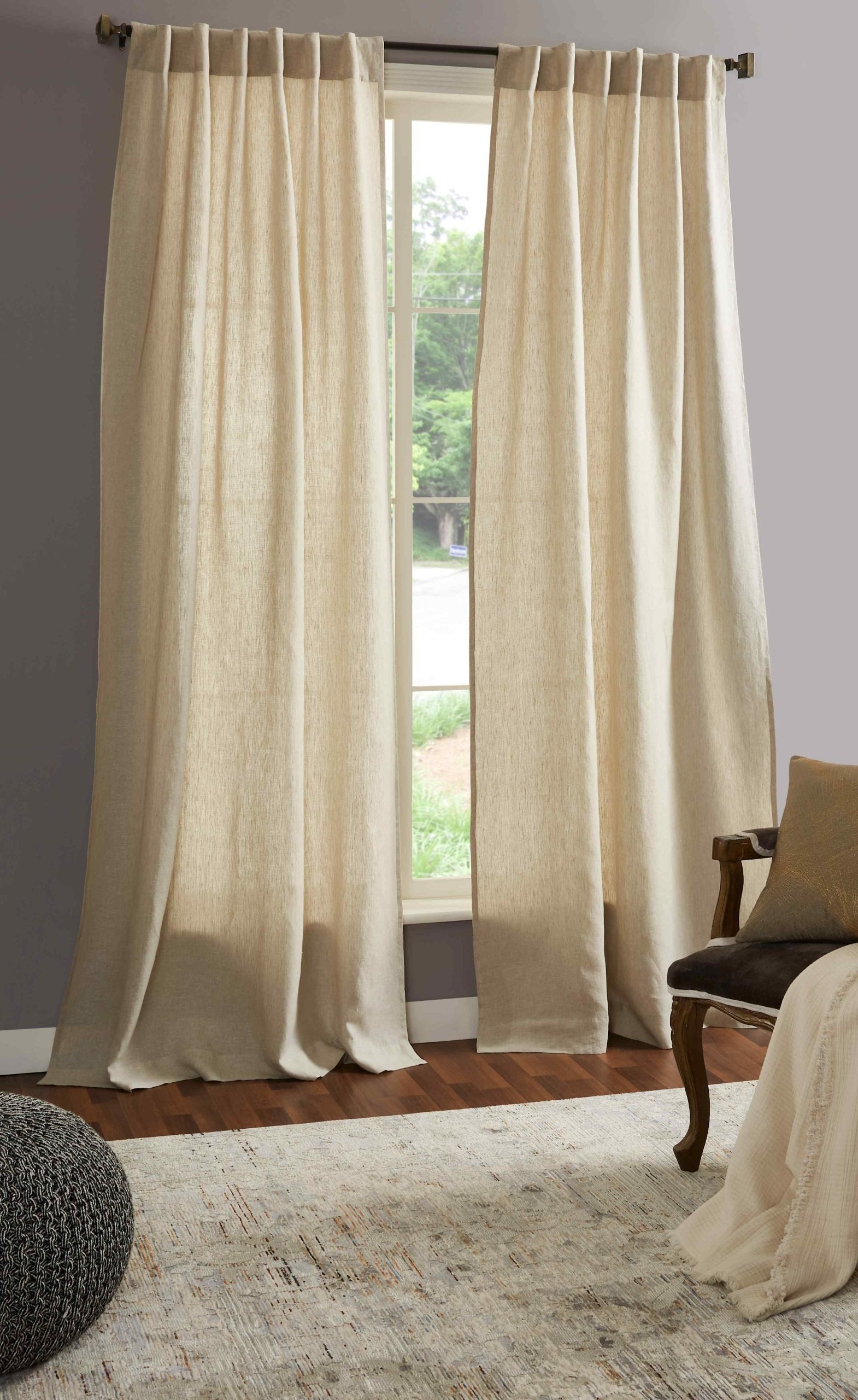 DY-711-5096_3|Pair of floor-length natural linen-look curtains framing a bright window, adding a stylish, airy and elegant touch to any living space.