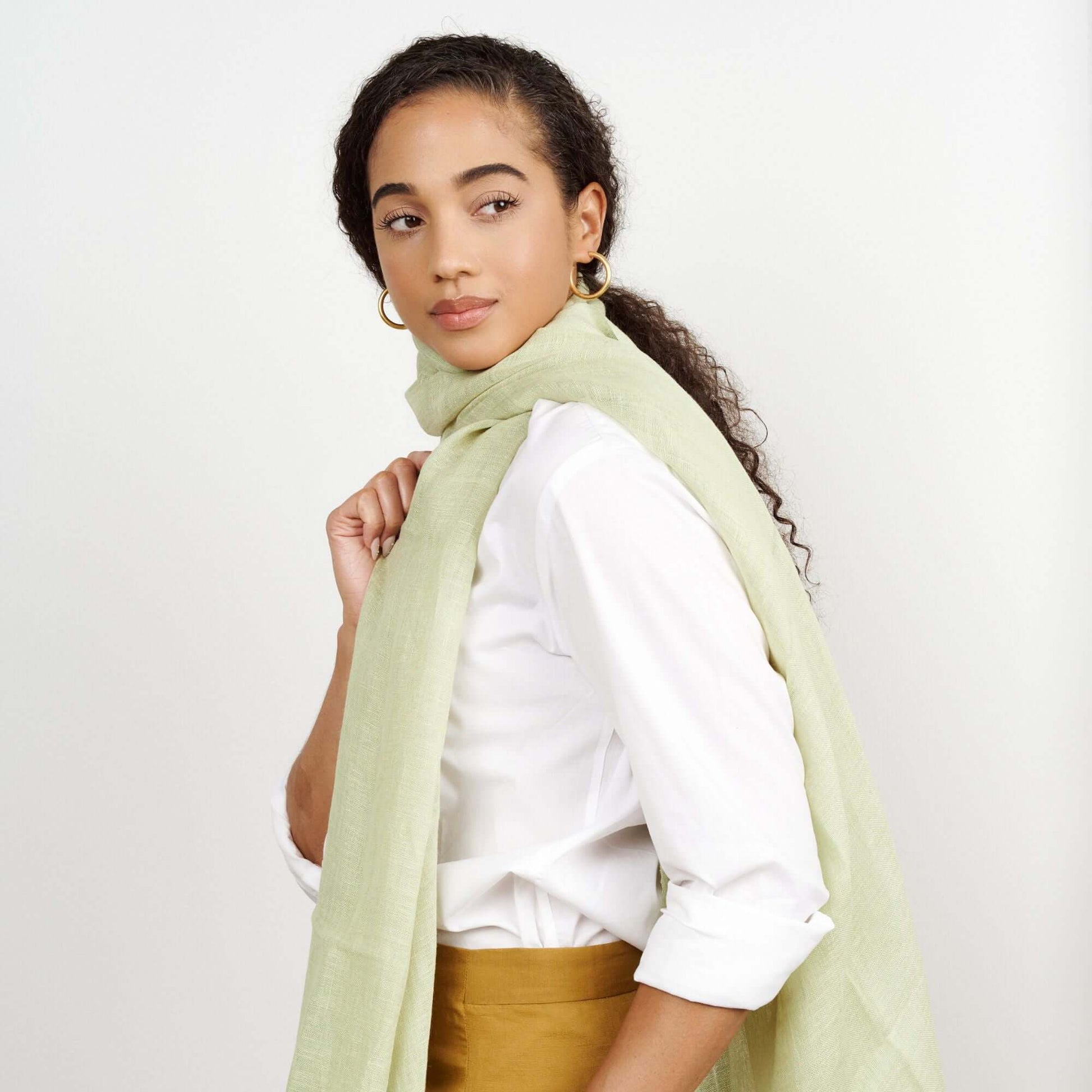 Soya Pastel Lime Green Hand Woven Soft Linen Scarf worn by a model, showcasing its texture and color.