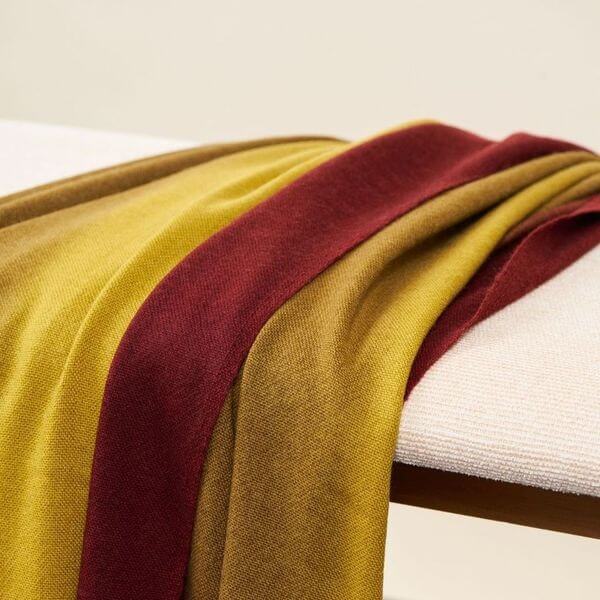Marigold Merino Ombre Handloom Throw / Blanket Scarf showcasing a warm color gradient and hand-rolled fringes.