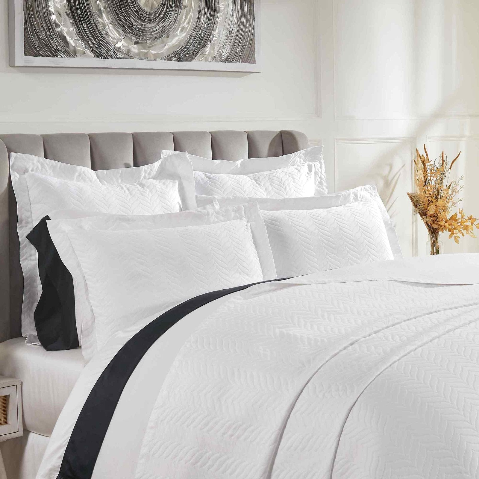 CL-194-9496_2|Close-up of elegant white chevron quilted coverlet, showcasing its intricate pattern and soft texture for luxurious bed styling.