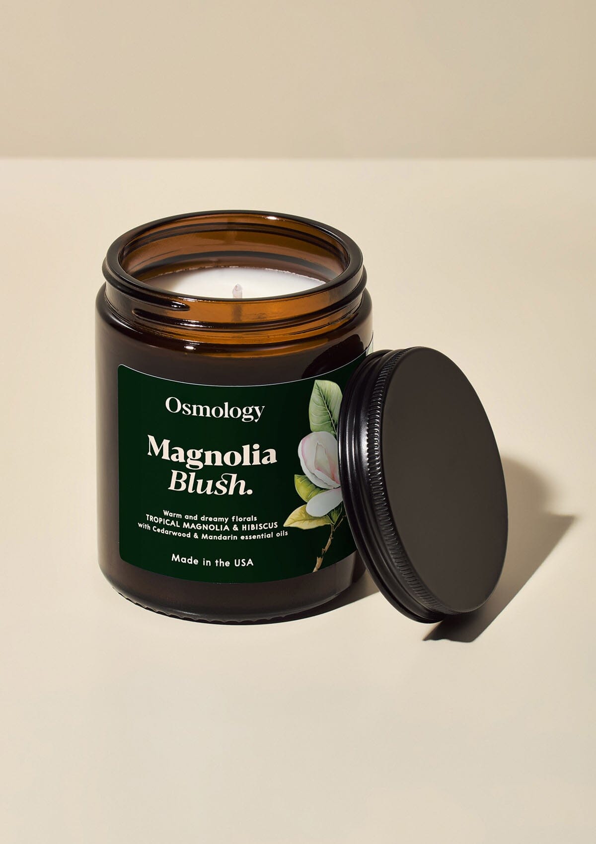 Magnolia Blush jar candle with lid  by osmology displayed on white background 