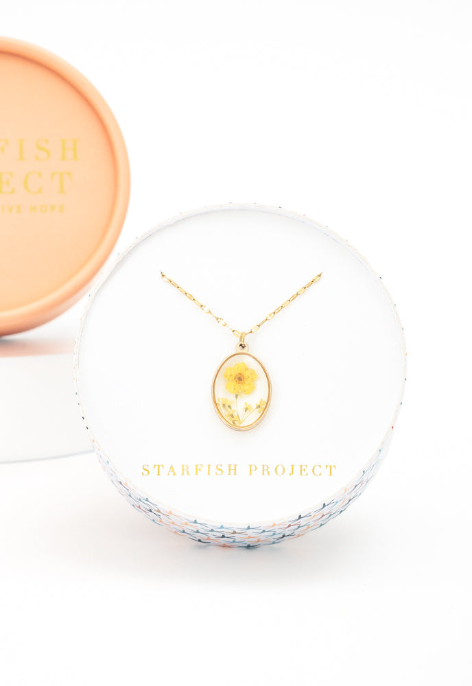 Gift box with gold flower necklace, fair trade gifting company, gift ideas for the holidays 
