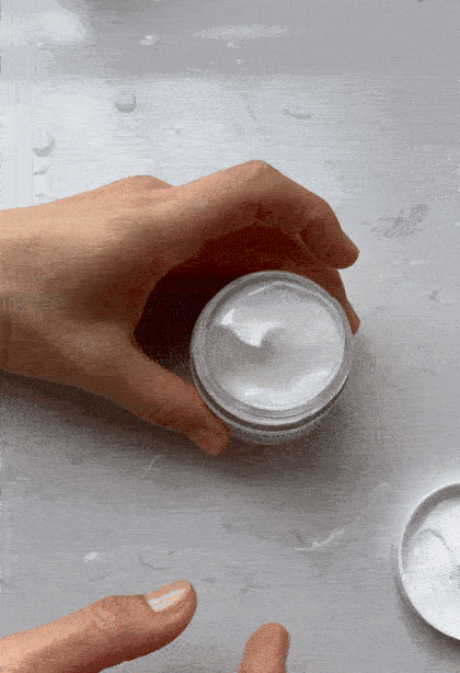 GIF of a  hand applying a moisturizer on the other hand