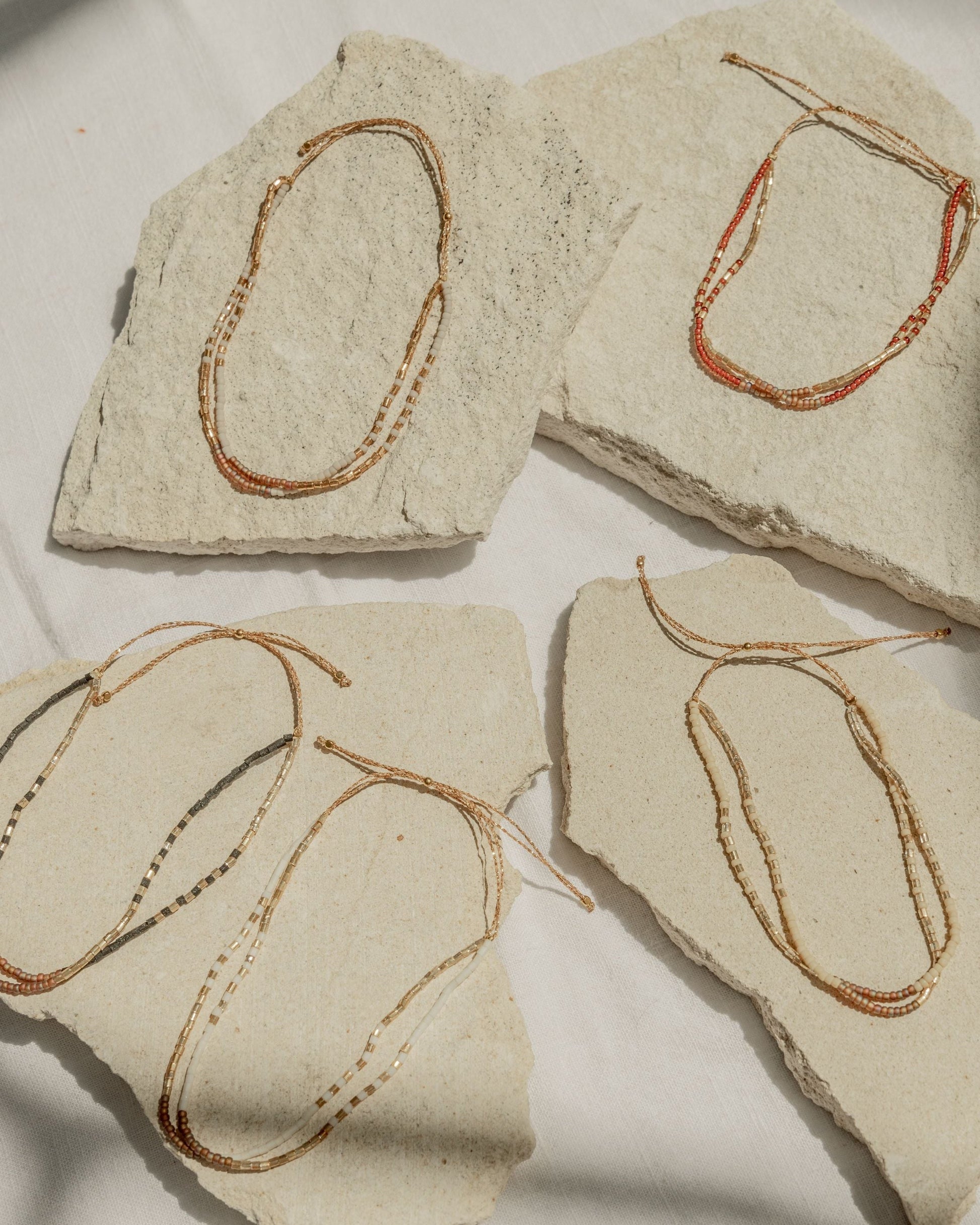 Golden Beaded Bracelet handmade by Village Thrive using natural materials.
