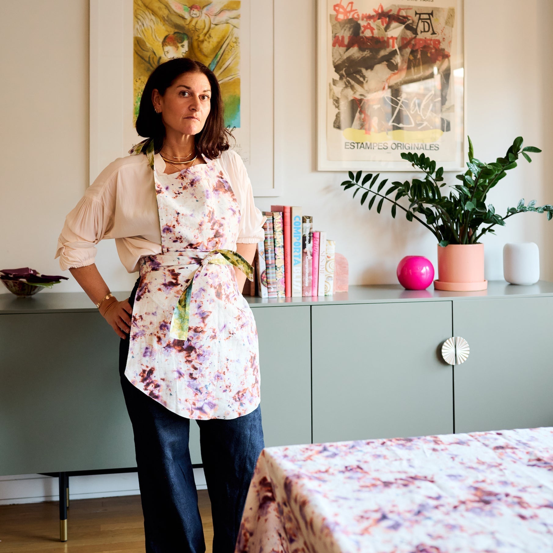 The Gemma Apron in Marble shown front view on model in kitchen - Goldie Home