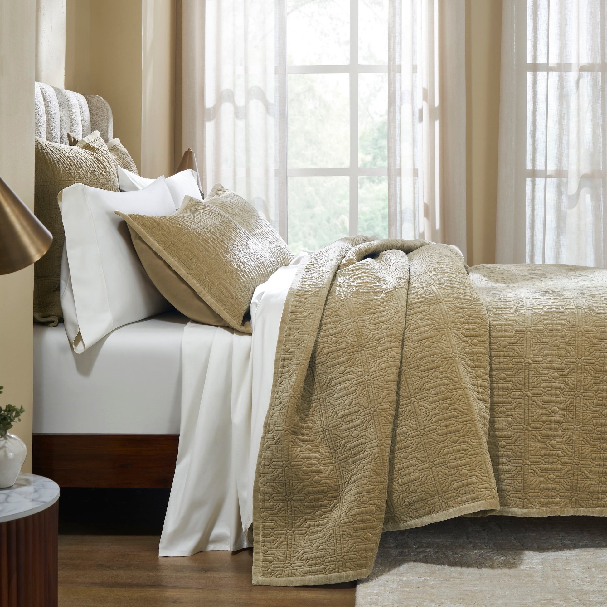 QT-377-11096_3|Elegant tan quilted bedspread with a geometric pattern, draped over a bed with white sheets and pillows, enhancing cozy bedroom decor.