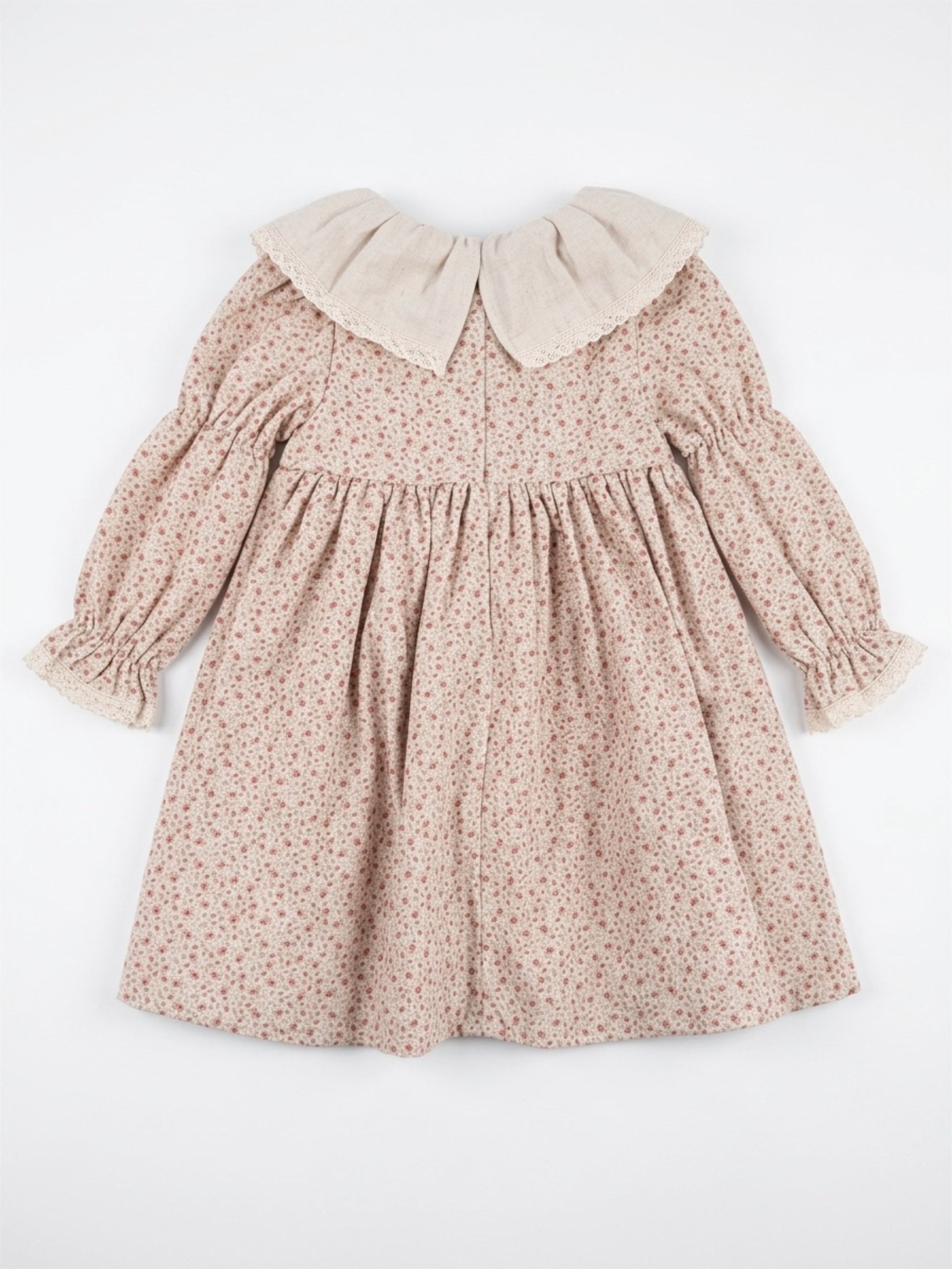 Floral dress with a beige collar on a white background