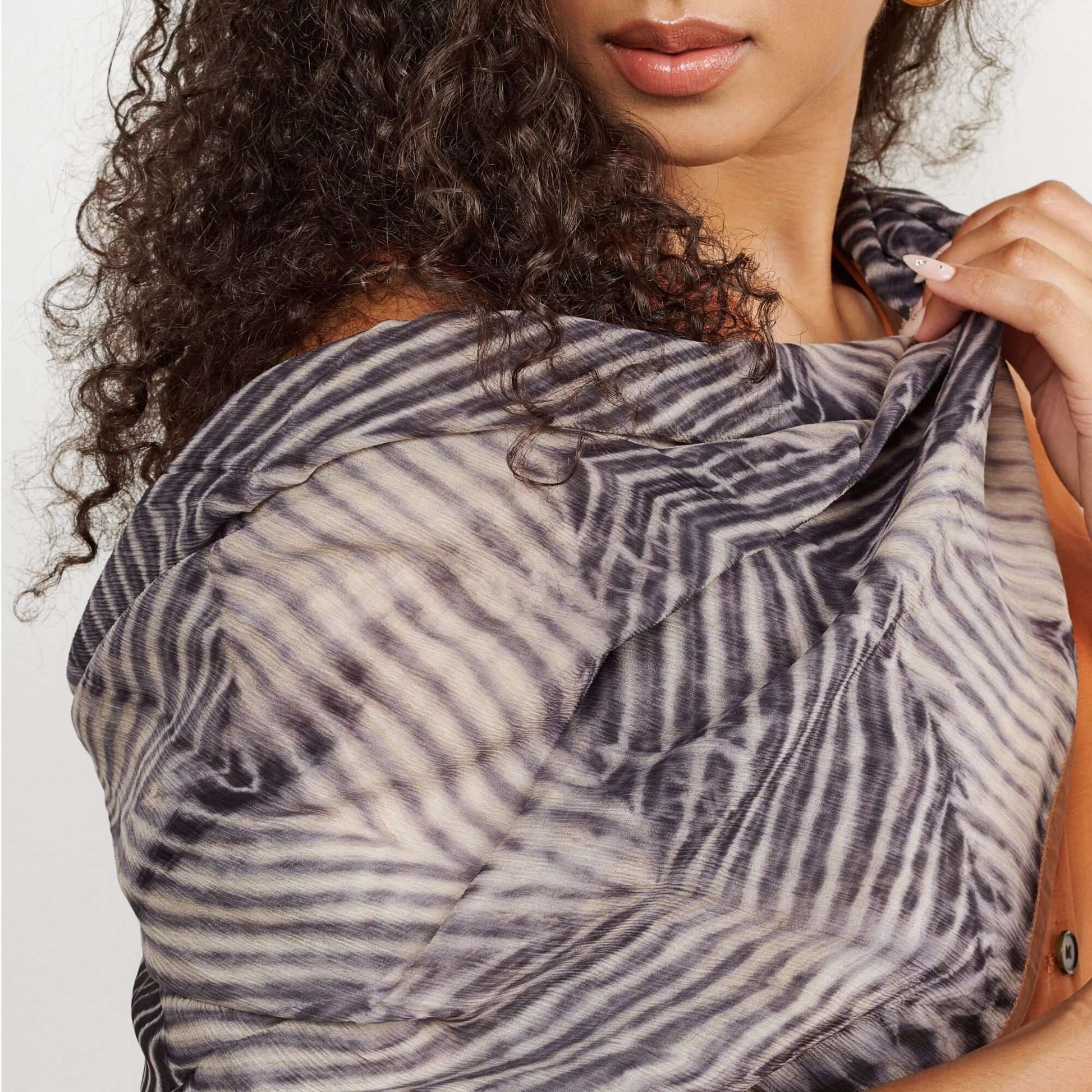 Samu Black hand crafted chiffon square scarf with unique shibori print, elegantly worn as a wrap.
