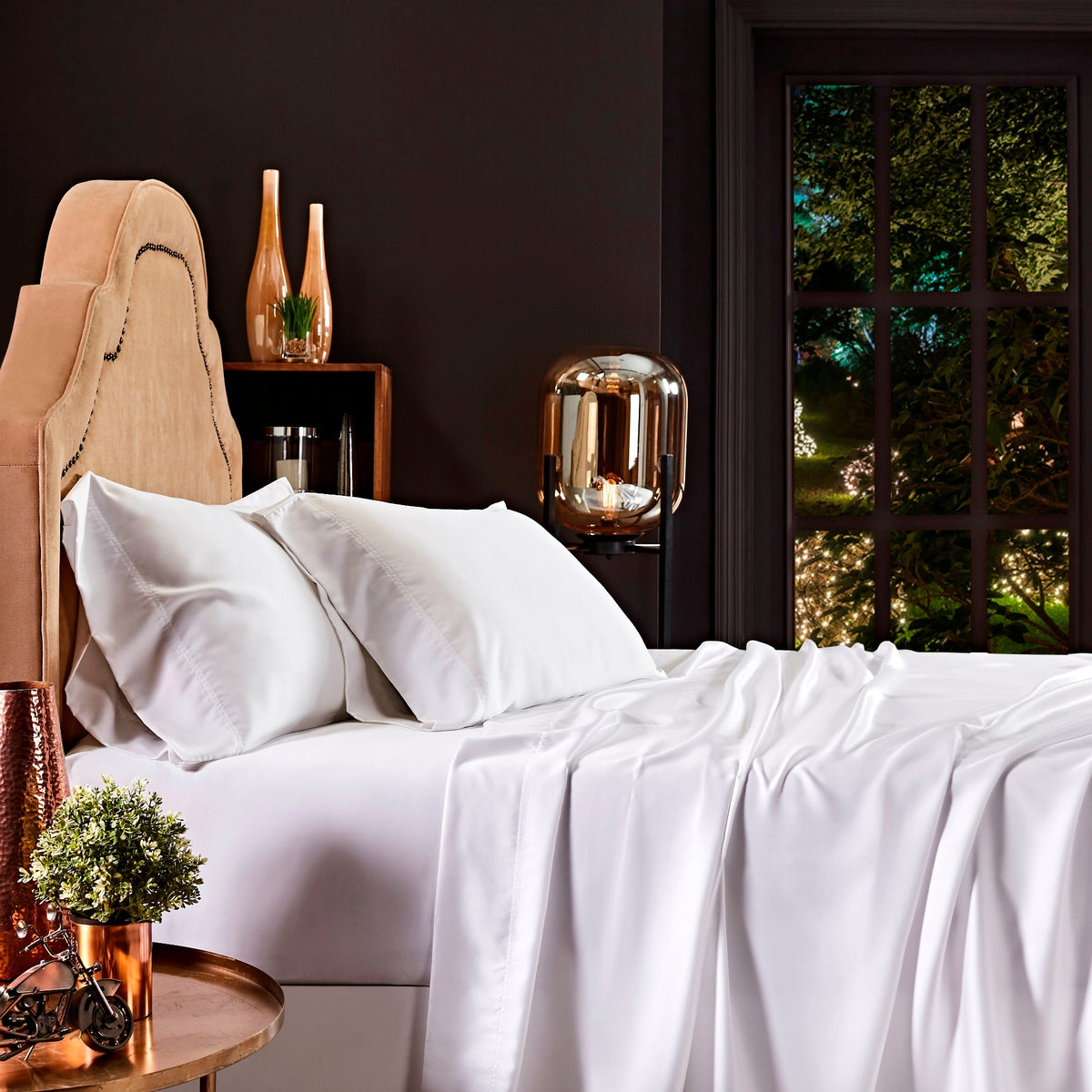 QFT-509-6080_2|Luxurious white 100% Lyocell sheets draped over a bed, with smooth, breathable fabric, perfect for a comfortable night's sleep.