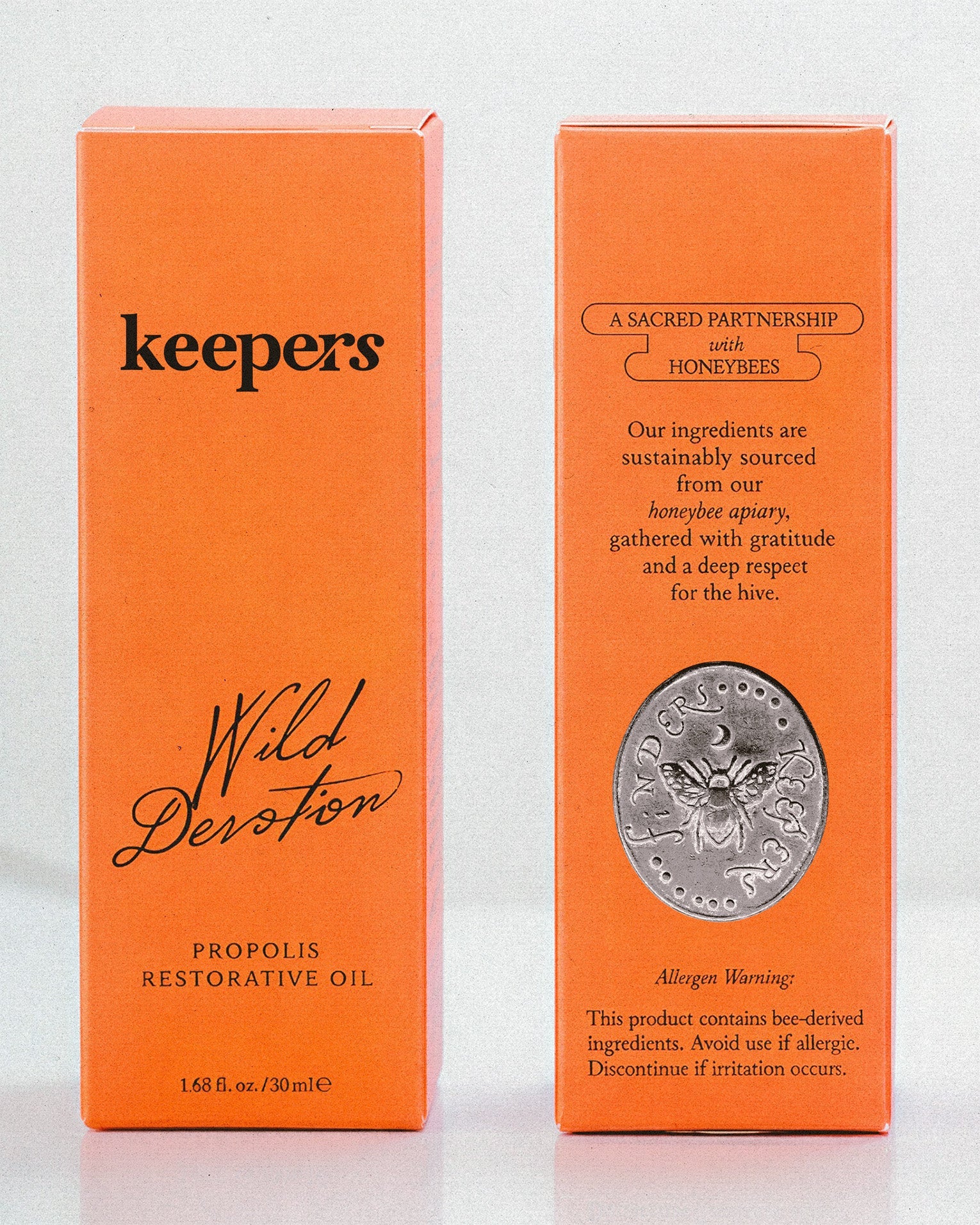 Wild Devotion restorative oil bottle with flowers
