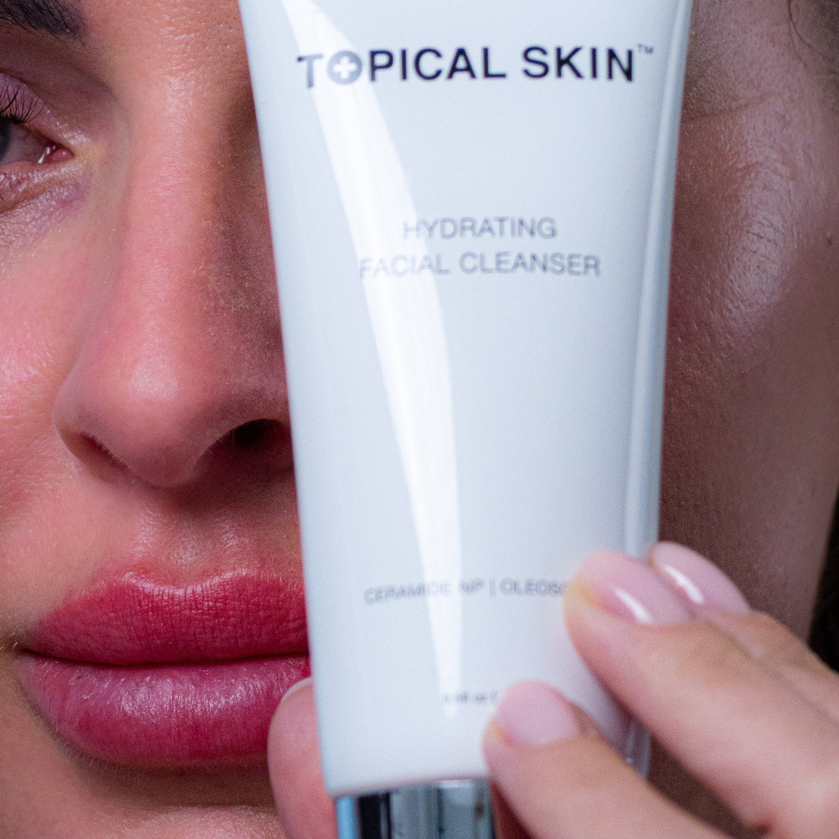Hydrating Facial Cleanser with Oleosomes by TOPICAL SKIN DERMACEUTICALS, white facial cleanser tube with oleosome hydration