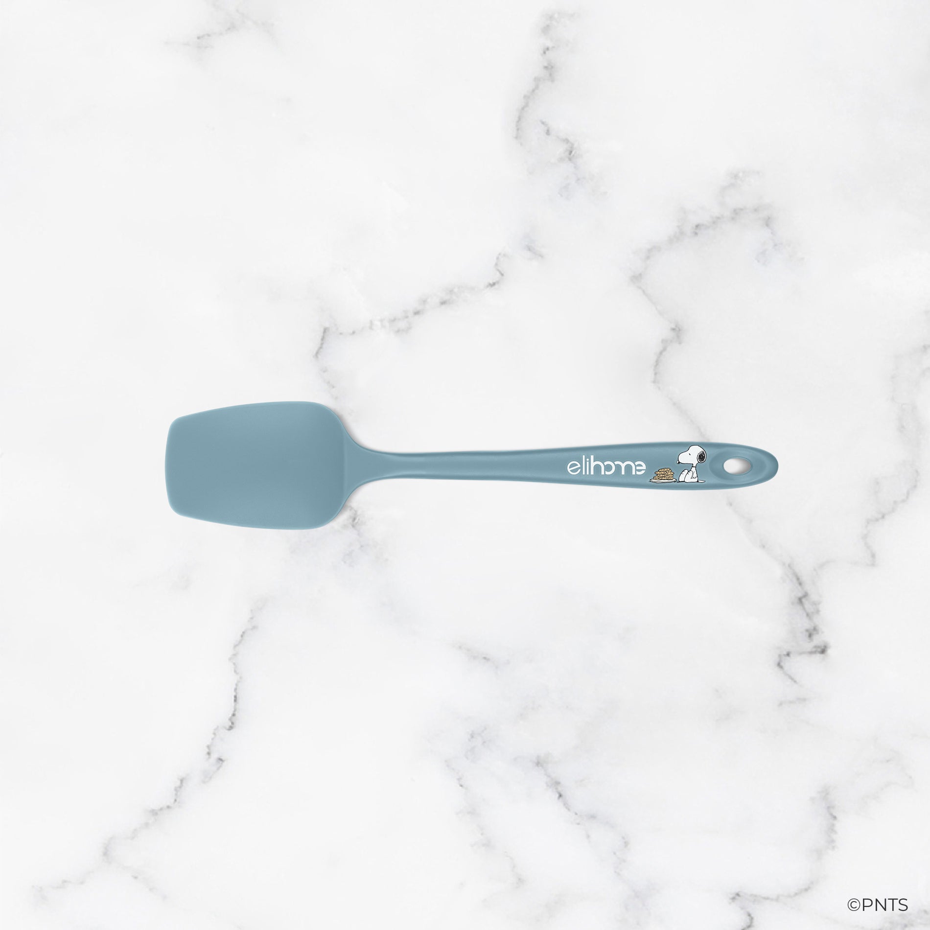 Blue spatula on a marble background