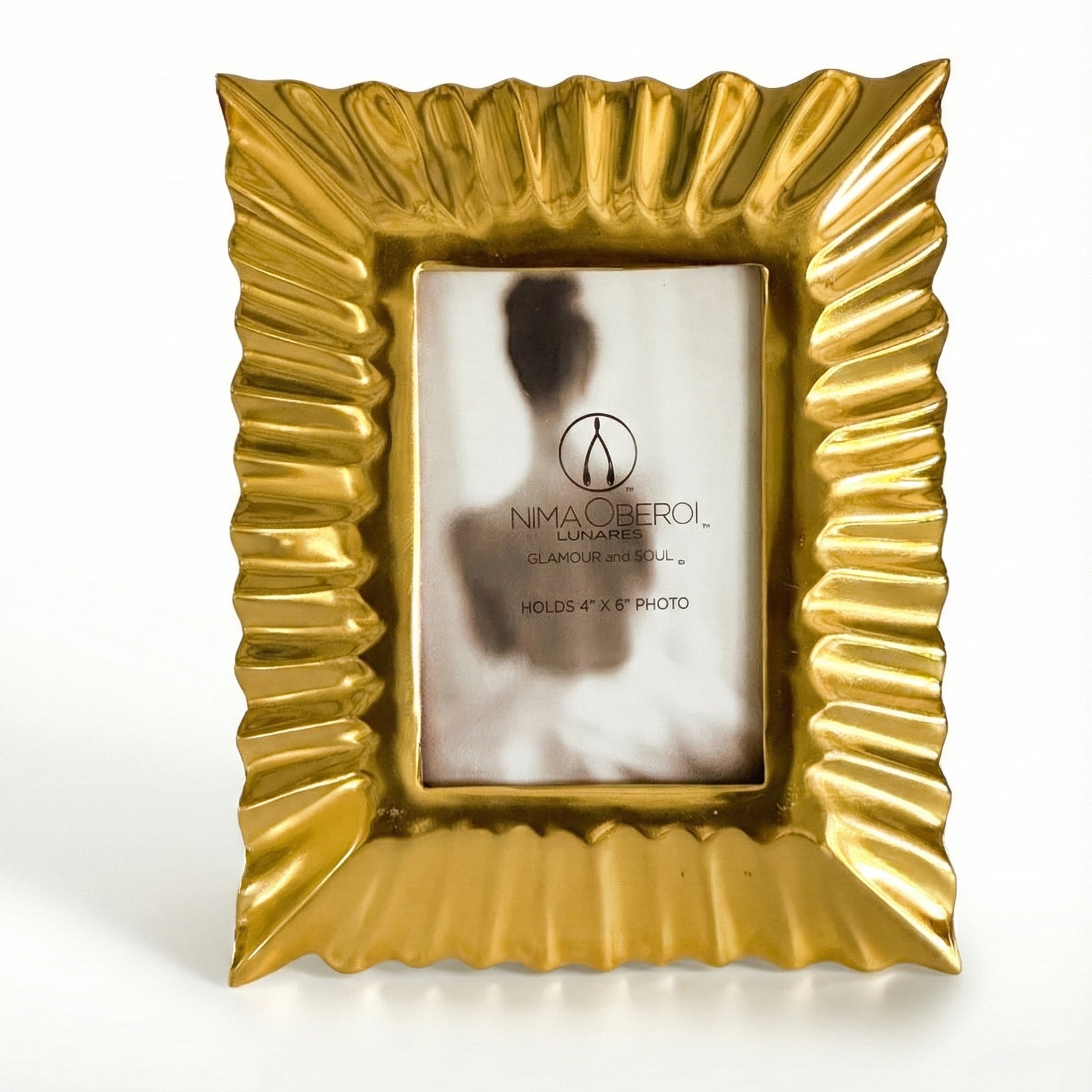 Gold picture frame with a white background