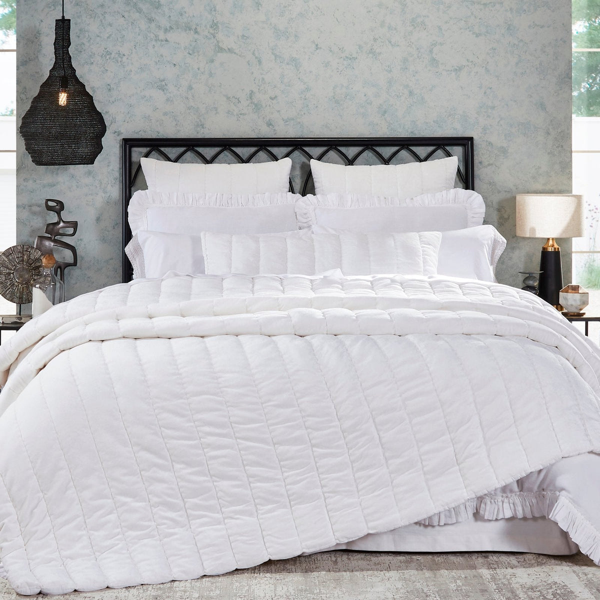 QT-337-9496_1|Crisp white textured quilt with sleek channel quilting on a beautifully styled bed. Modern and inviting bedroom decor.