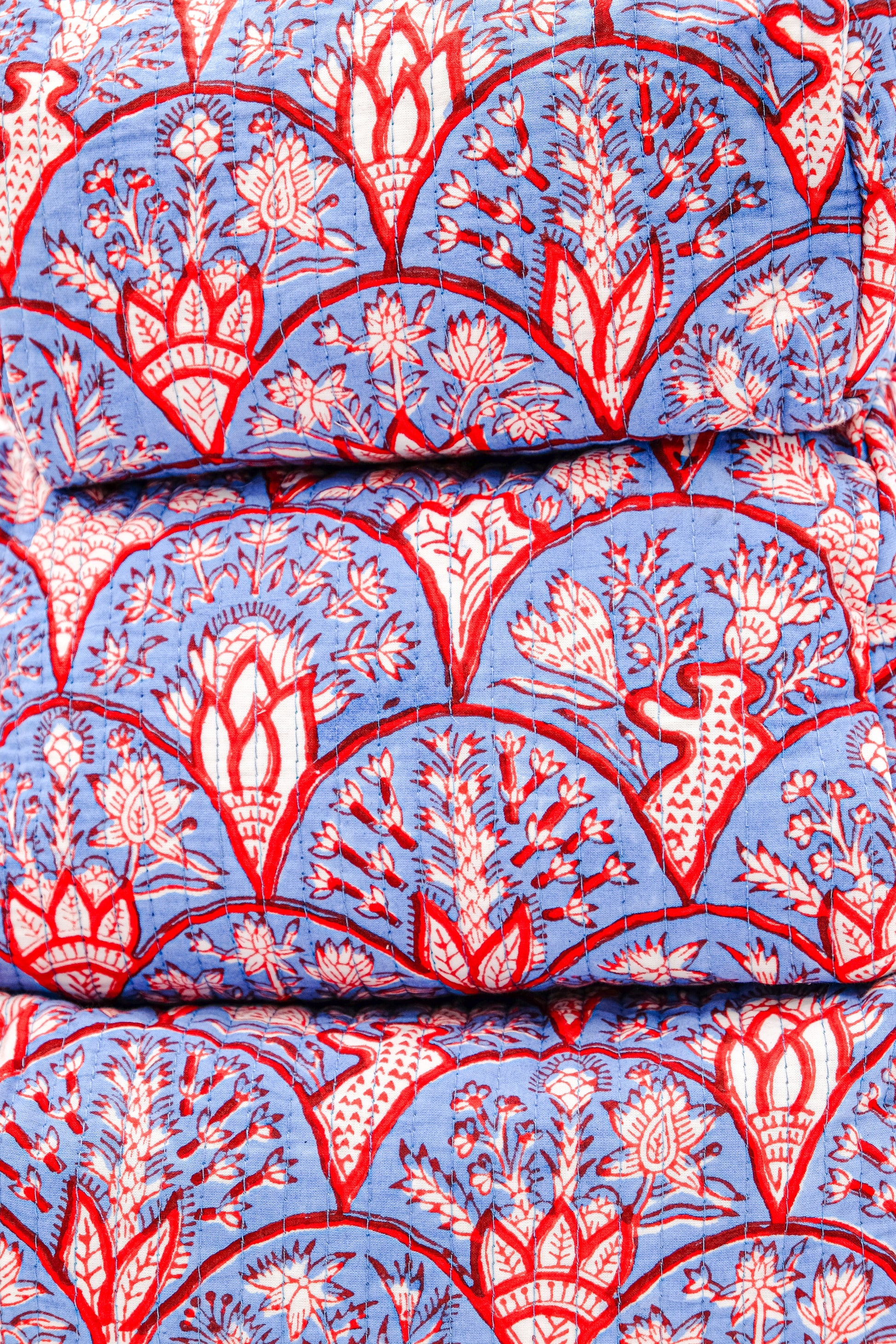 Blue Arch toiletry bag with red arch patterns from Inner Child studio