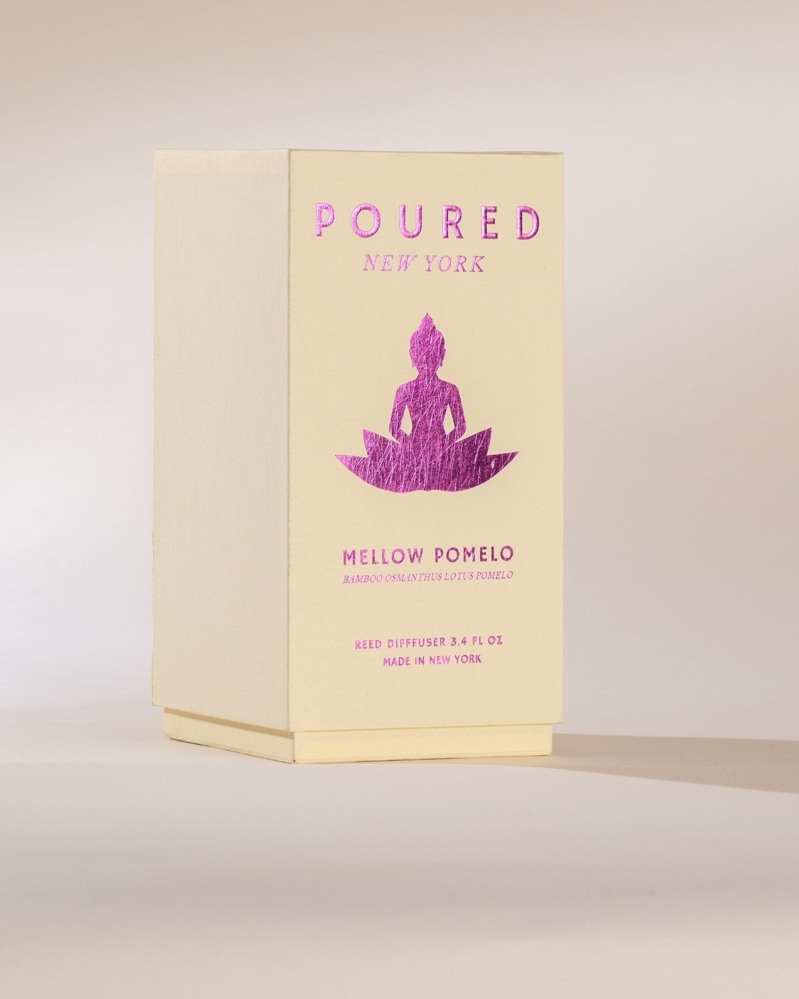 Poured New York 'Mellow Pomelo' Reed Diffuser Box on neutral background.