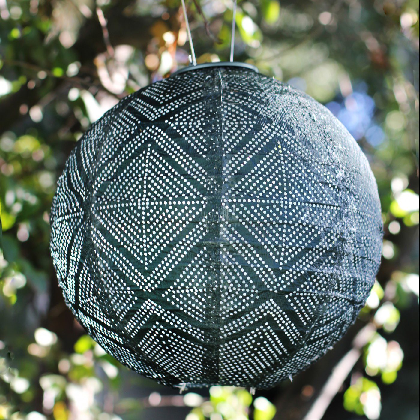Soji Stella Market 12" Tyvek Solar Lantern in tree
