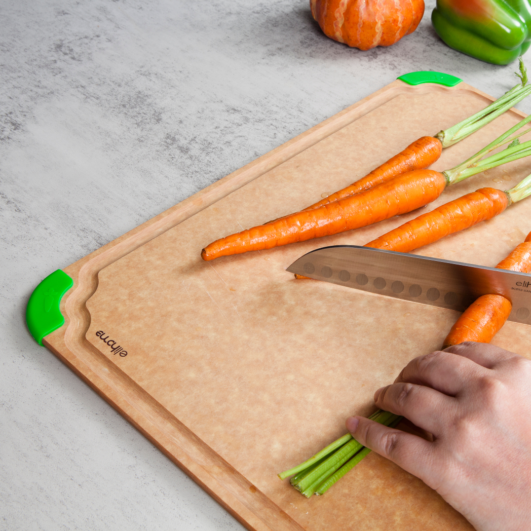 Preparing carrots and vegetables on Elihome Premium Series X-Large Cutting Board