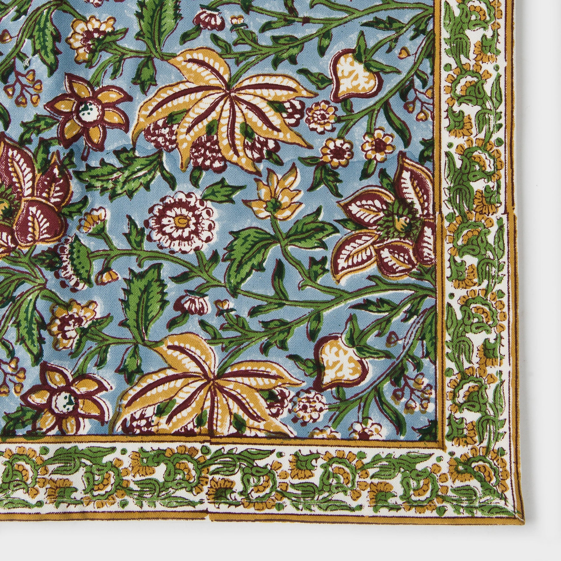 The set of 4 cotton placemats laid out to show their 18-inch length and 13-inch width