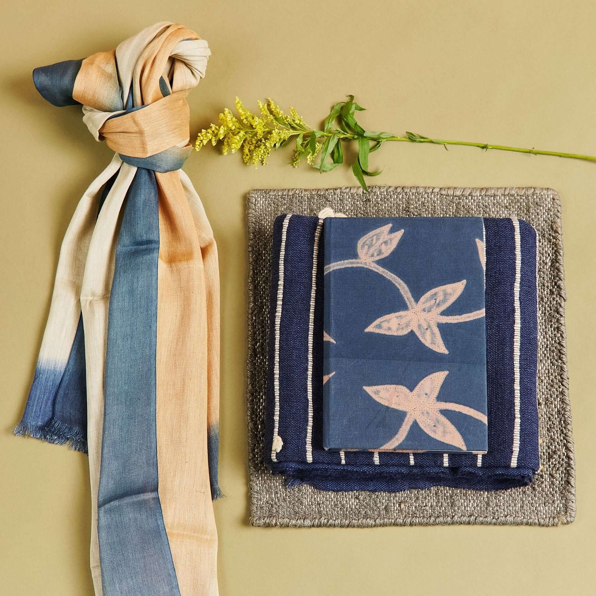 Oceana Beige Soft Linen Silk Handloom Scarf displayed with other textiles on a neutral background.