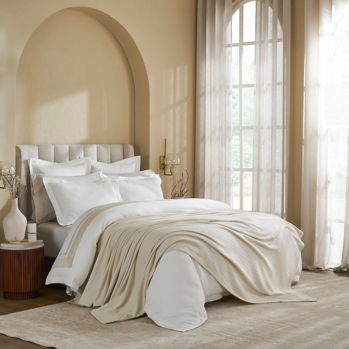 BL-866-9496_3|Elegant light beige subtly textured blanket stylishly draped at the foot of a luxurious bed, enhancing comfort.