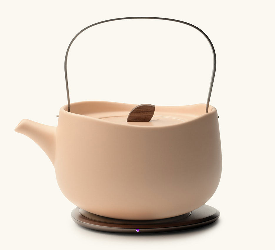 Leiph Self-Heating Ceramic Teapot Set 20 fl oz / 600 mL in Rosy Apricot on Ohom Charging Pad 3
