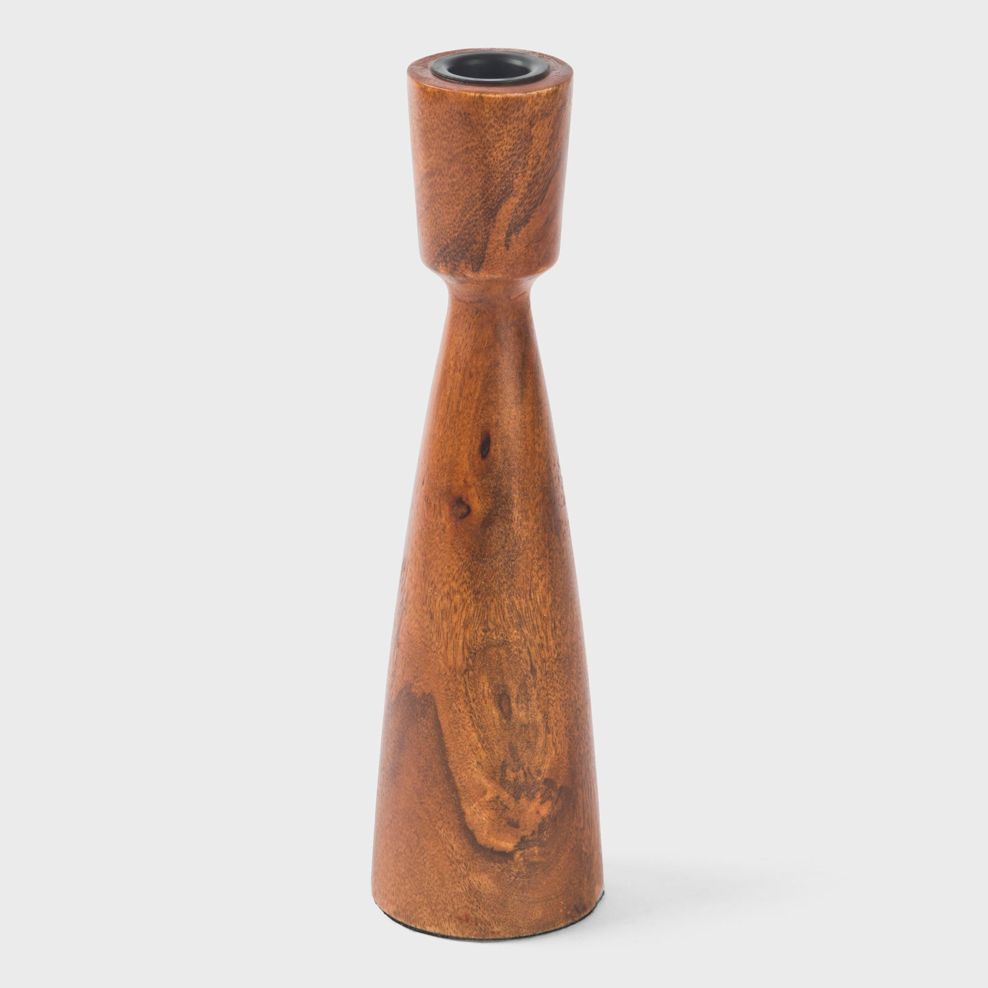 Artisanal wooden taper holders showing off the organic texture and warm matte finish of solid mango wood.