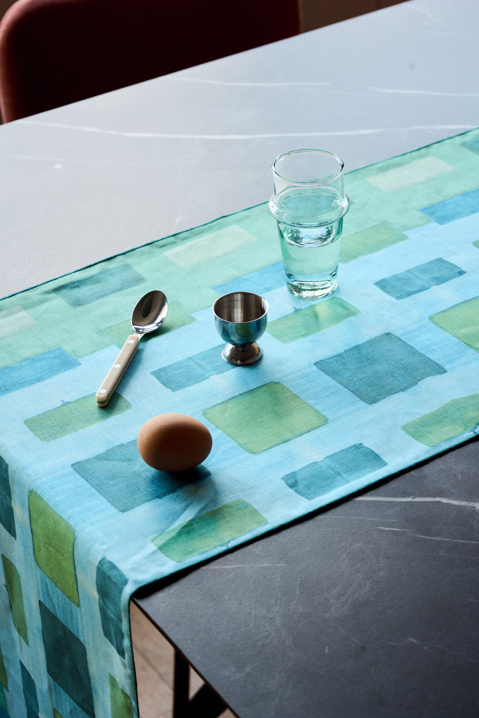 Blue Tapestry linen table runner flat lay close up of abstract brushstroke detail - Goldie Home