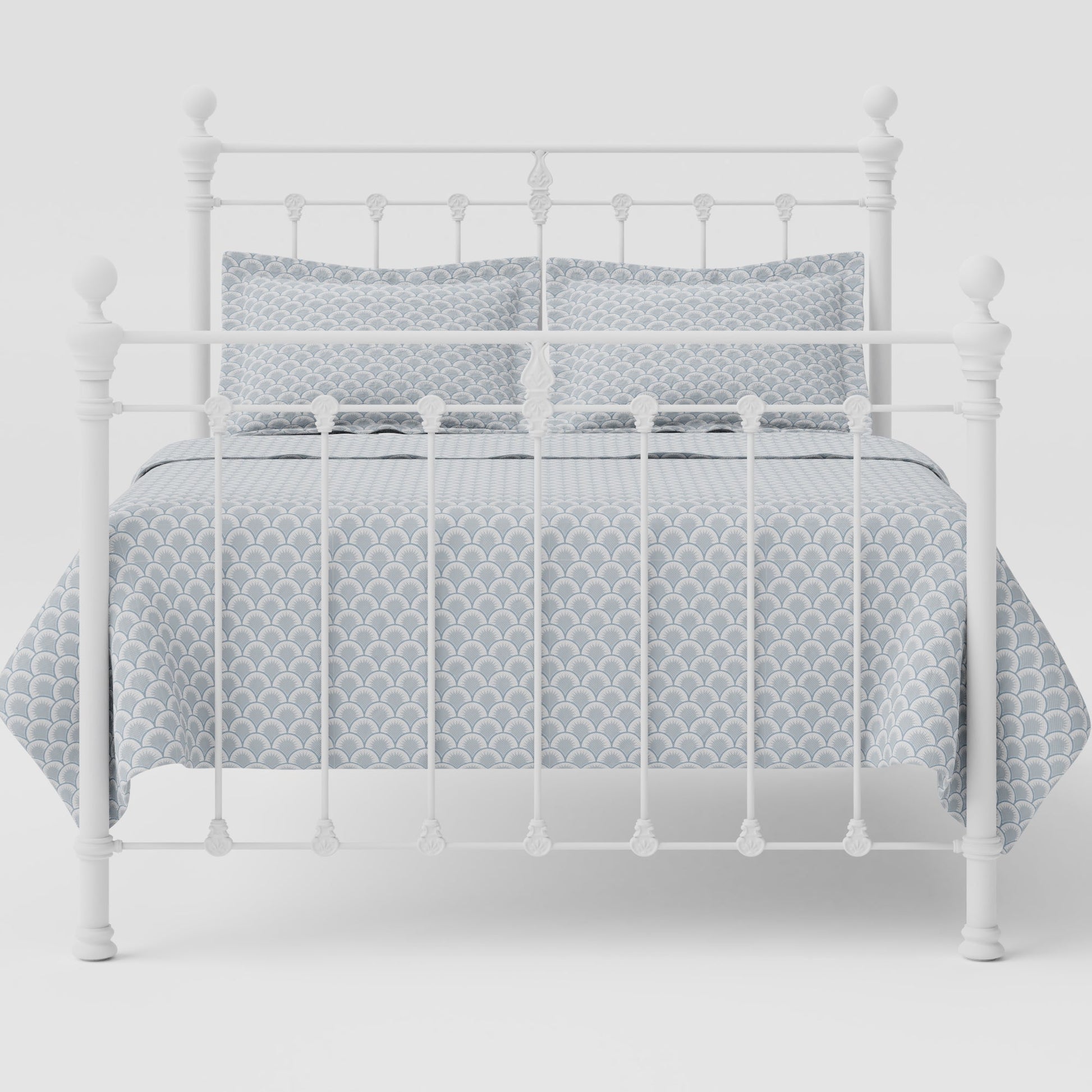 MB-201-7680_4|White metal bed frame with delicate scrollwork, dressed with patterned bedding. Classic design, versatile for any room.