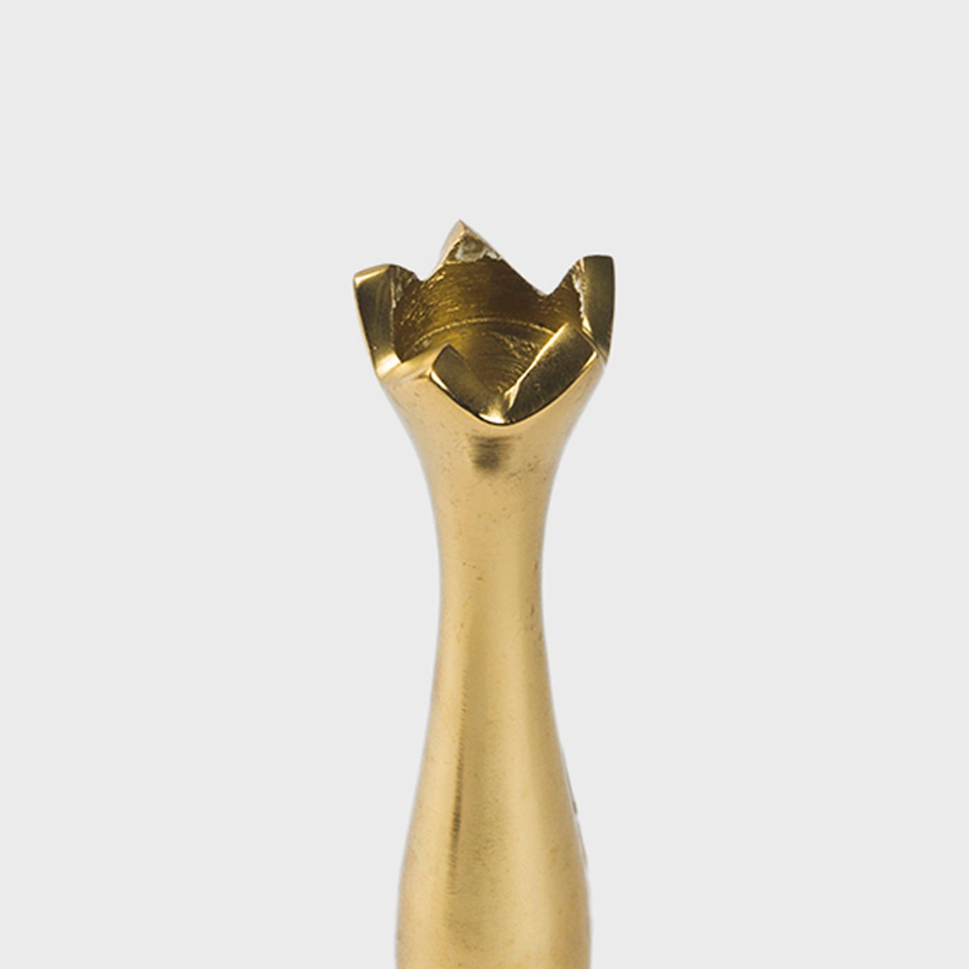 Close-up of the hand-finished gold sheen on the Holiday Accents brass candlestick holders
