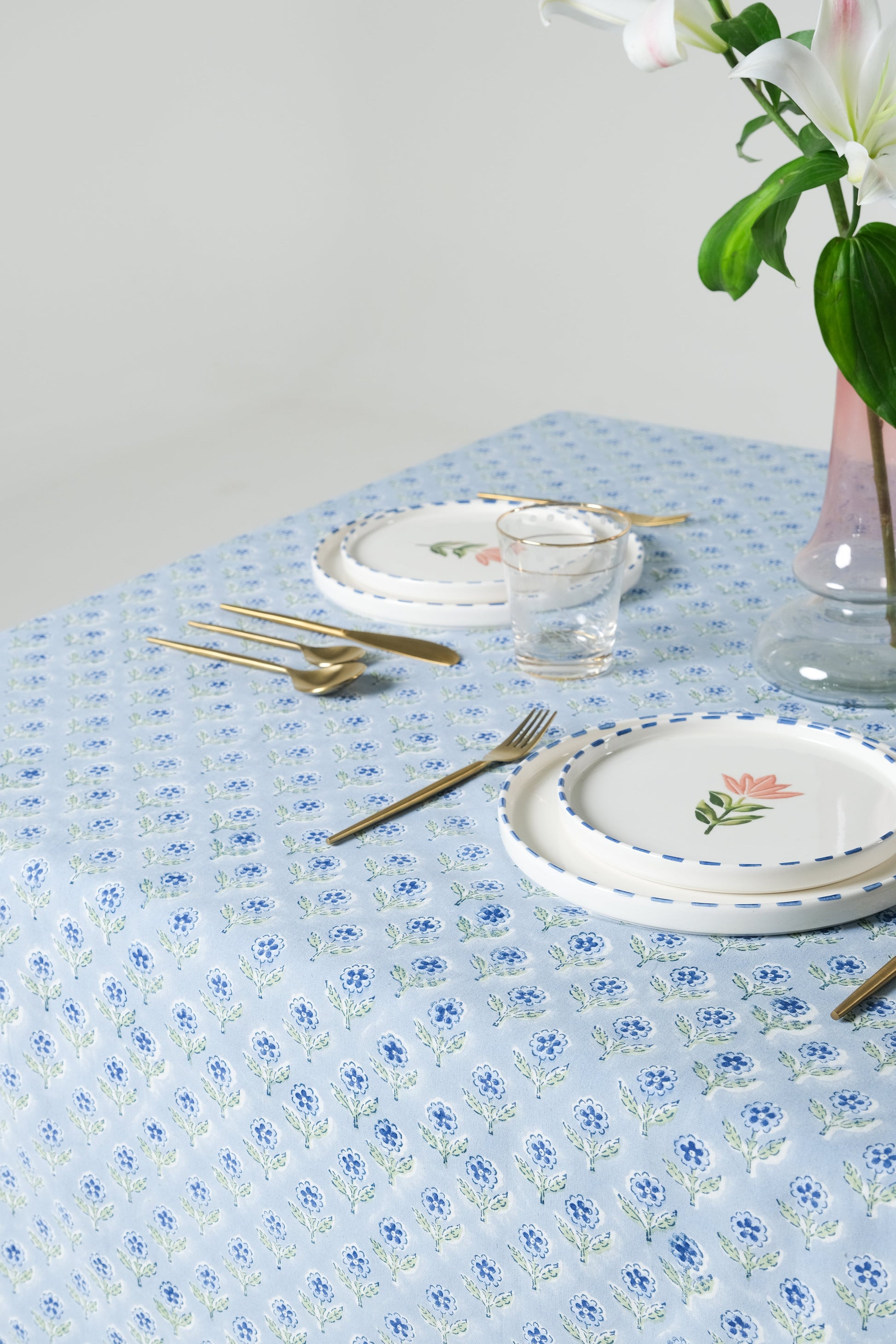 Mona scallop embroidered blockprint blue tablecloth on dining table