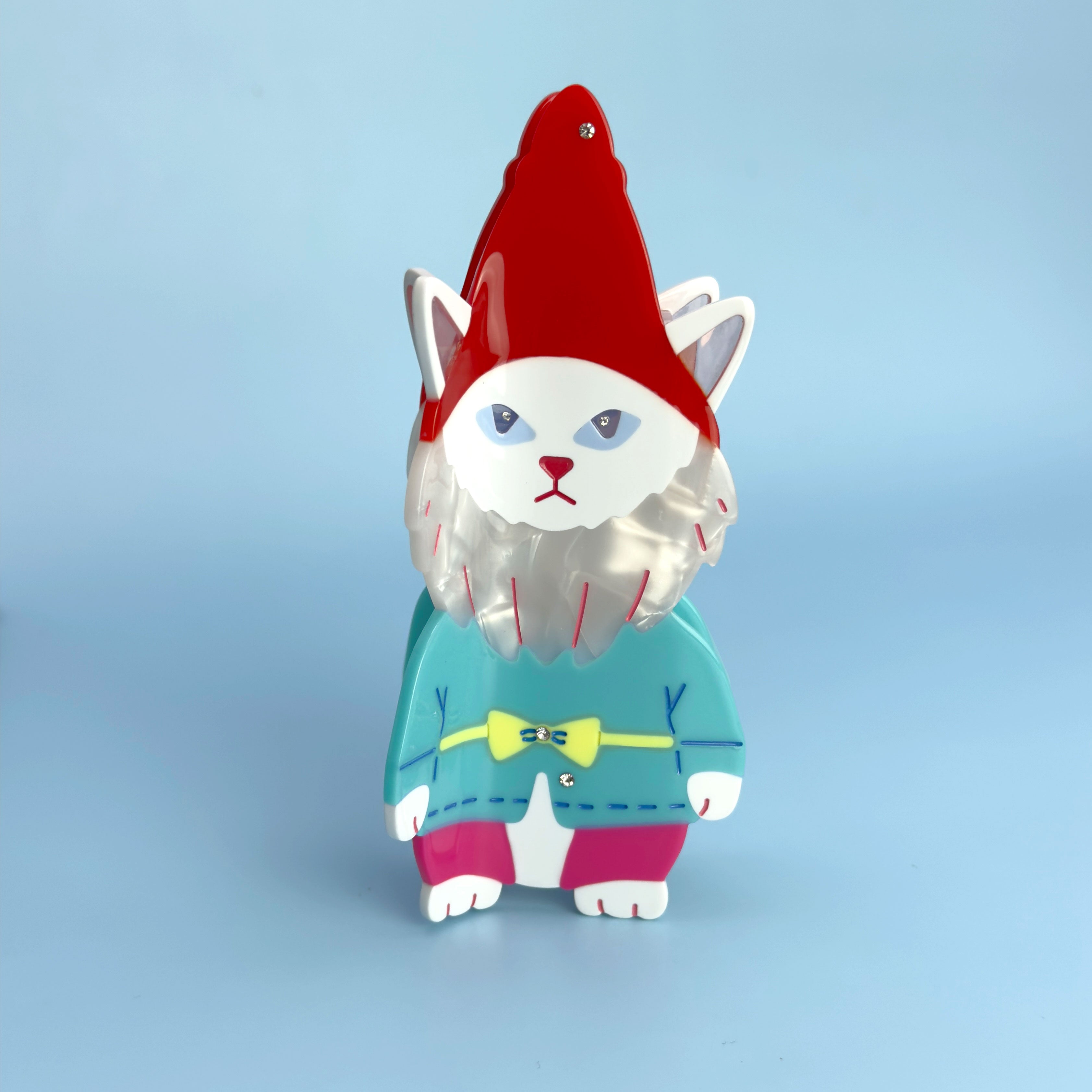 Cat garden gnome From Lawn Ornament to Hair claw Accessory World Traveler in red, blue and pink. Handmade on cellulose acetate, with splice technique, exquisite miniature details and crystals, that are tied directly to its value and make them unique and special. 