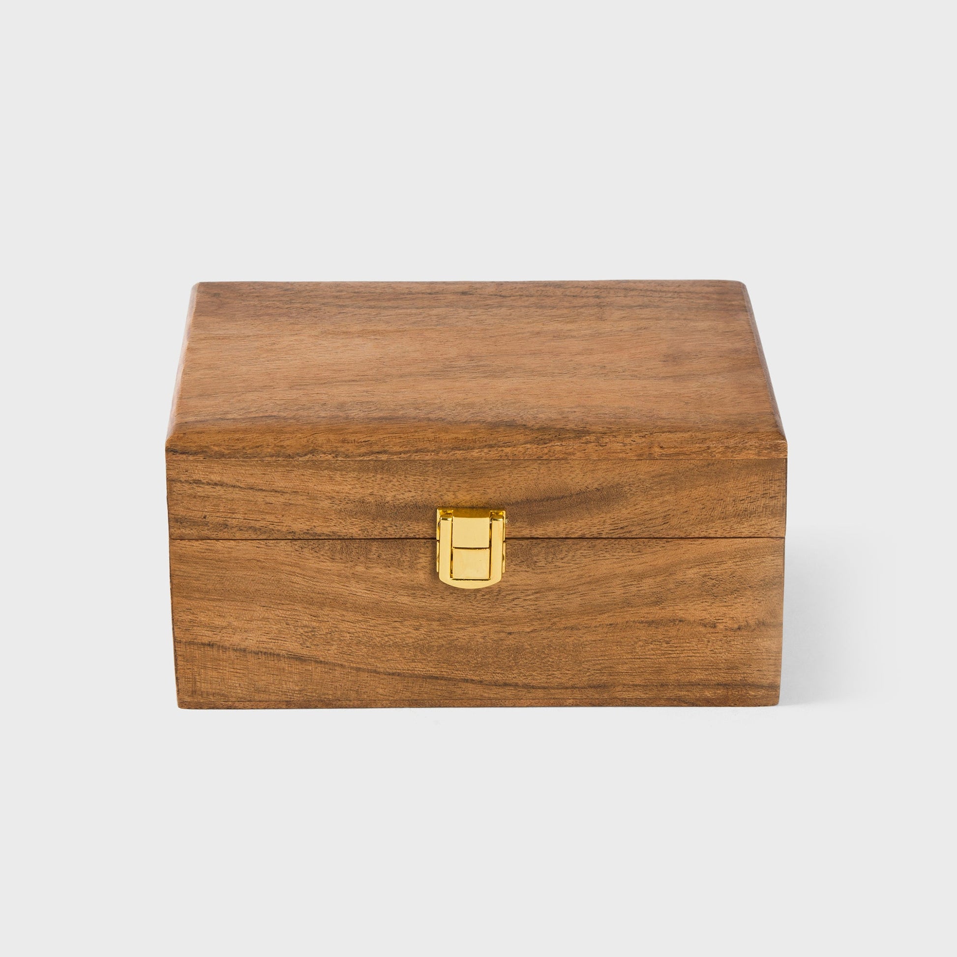 close-up of natural acacia wood grain and latch on handcrafted keepsake box
