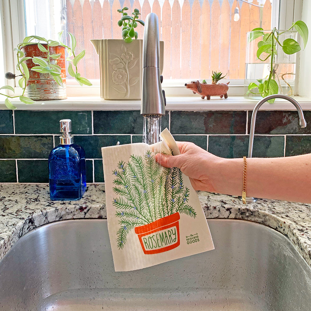 The Rosemary sponge cloth becomes wet under running kitchen sink faucet.