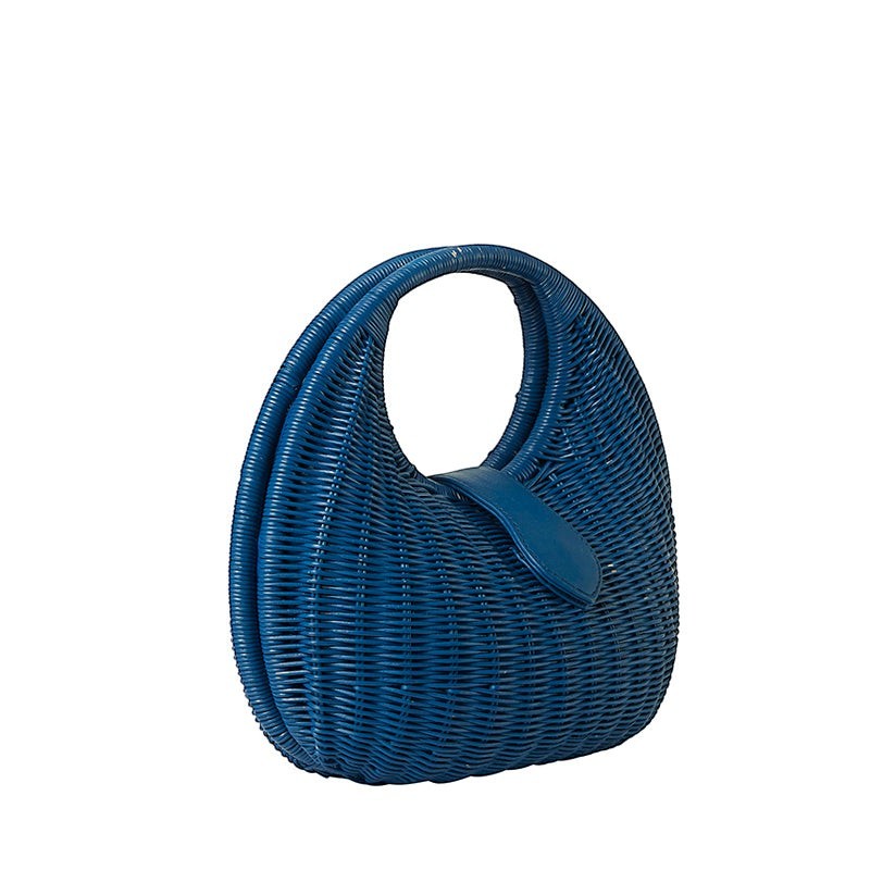Shop Sarah Stewart Matilda blue wicker handbag with leather strap detail. A modern, relaxed luxury accessory.